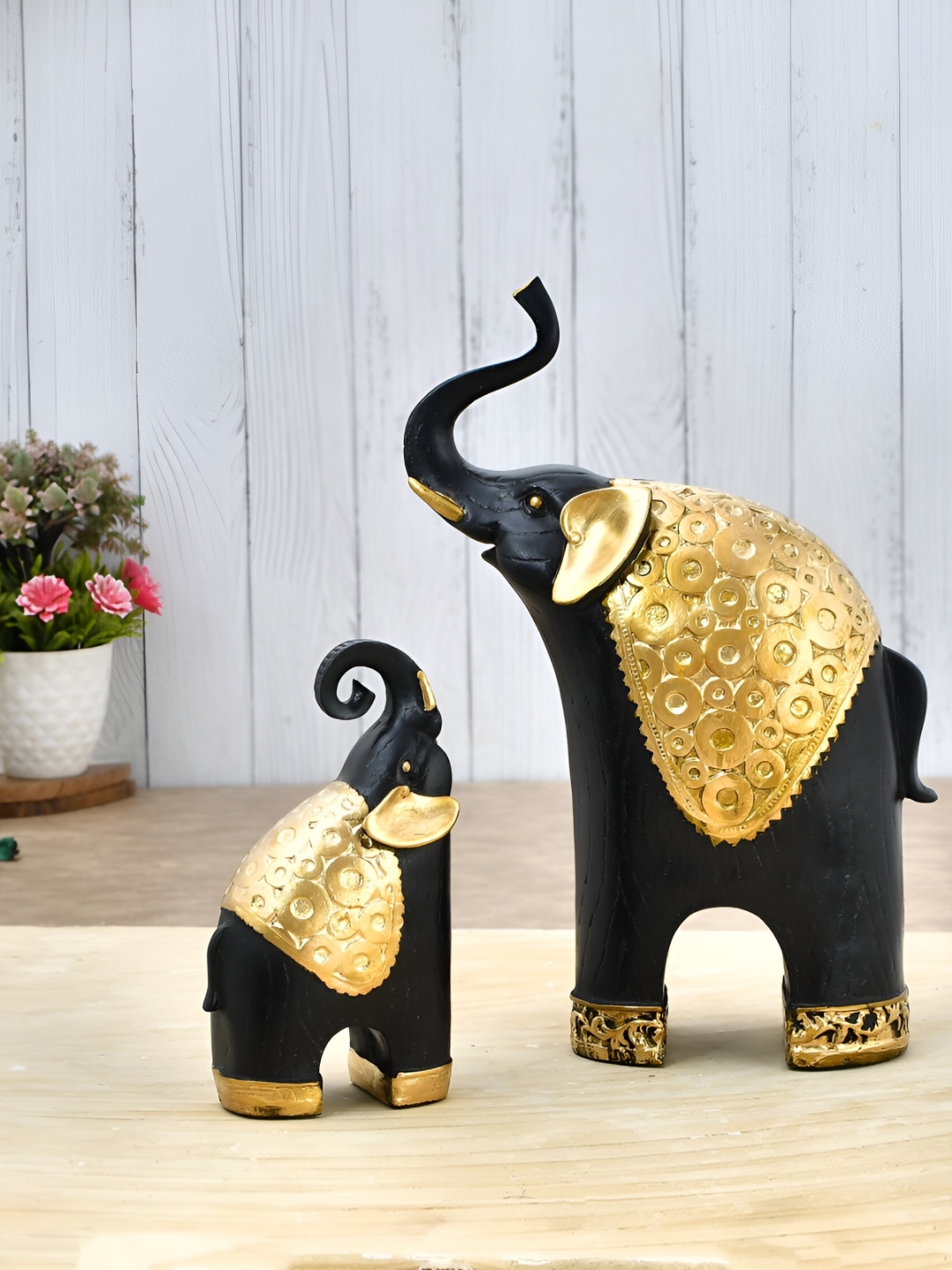 

Craft Junction Black & Gold Toned Elephant Figurine Showpiece