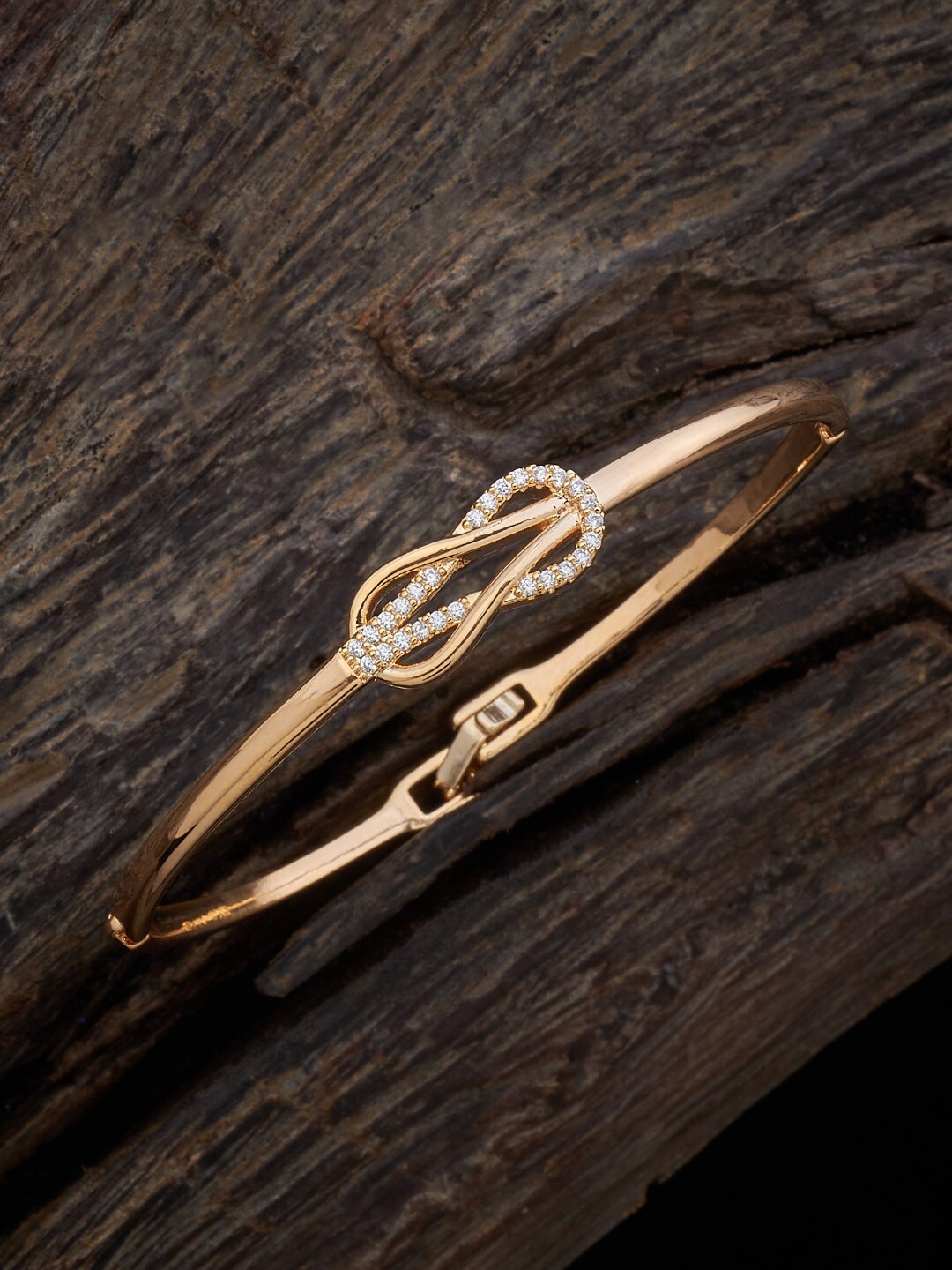 

Kushal's Fashion Jewellery Women Cubic Zirconia Gold-Plated Kada Bracelet