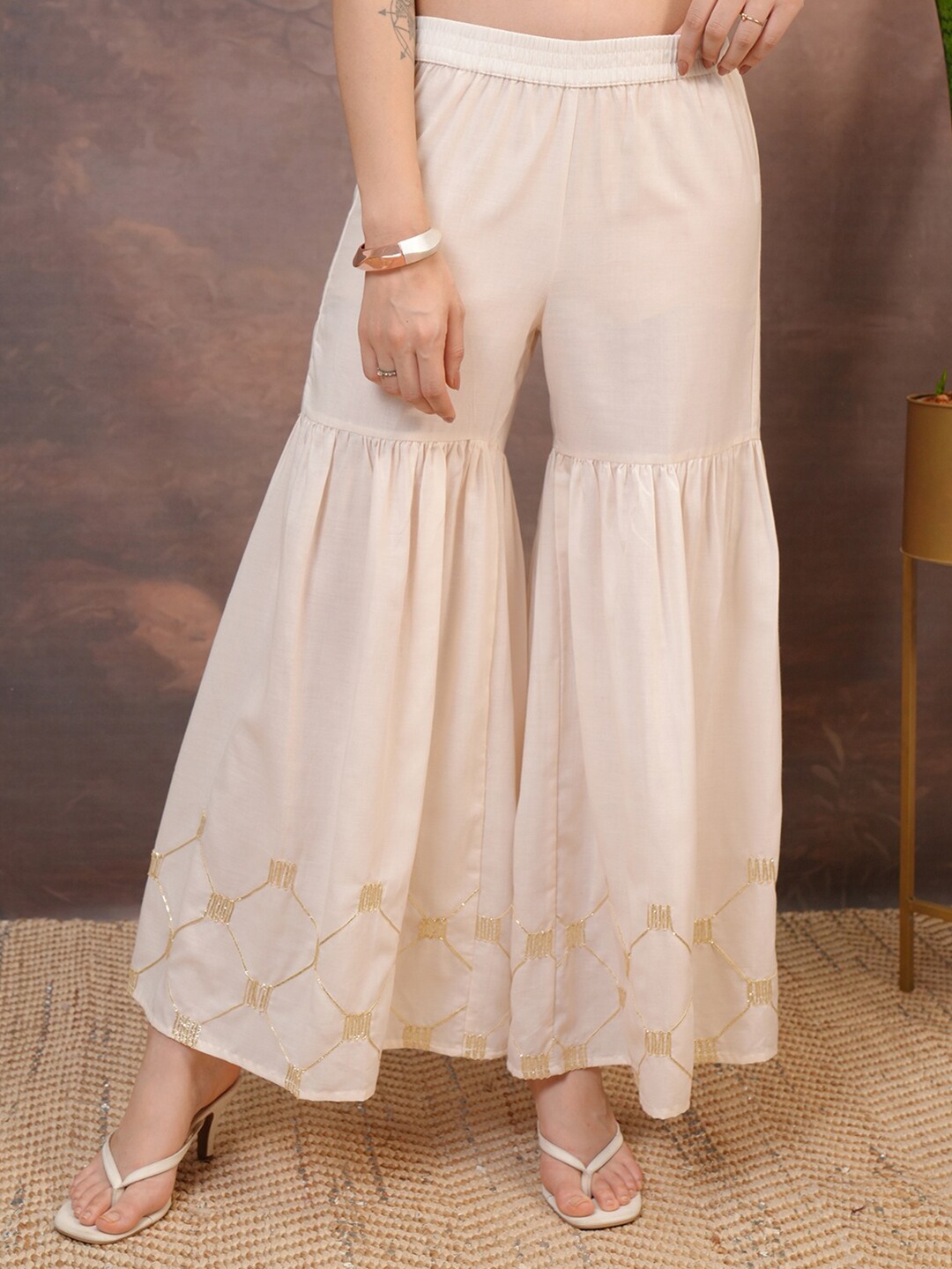 

Vishudh Beige Embroidered Flared Palazzos