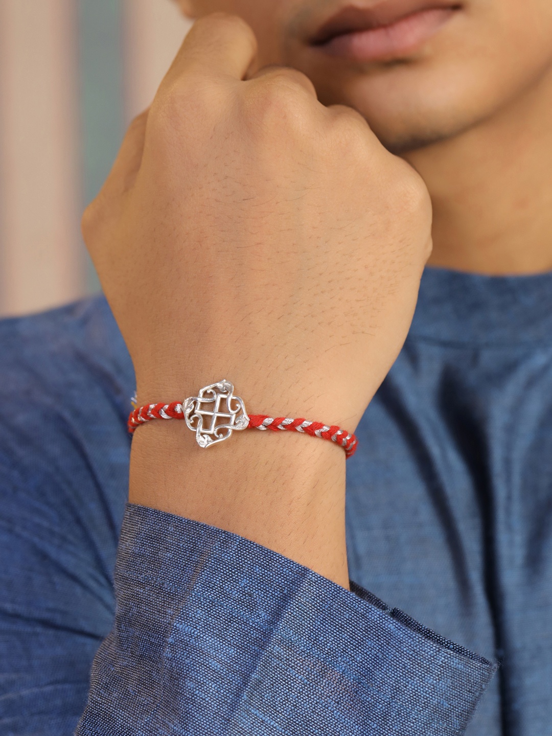 

Kicky And Perky 925 Sterling Silver Swastik Thread Rakhi