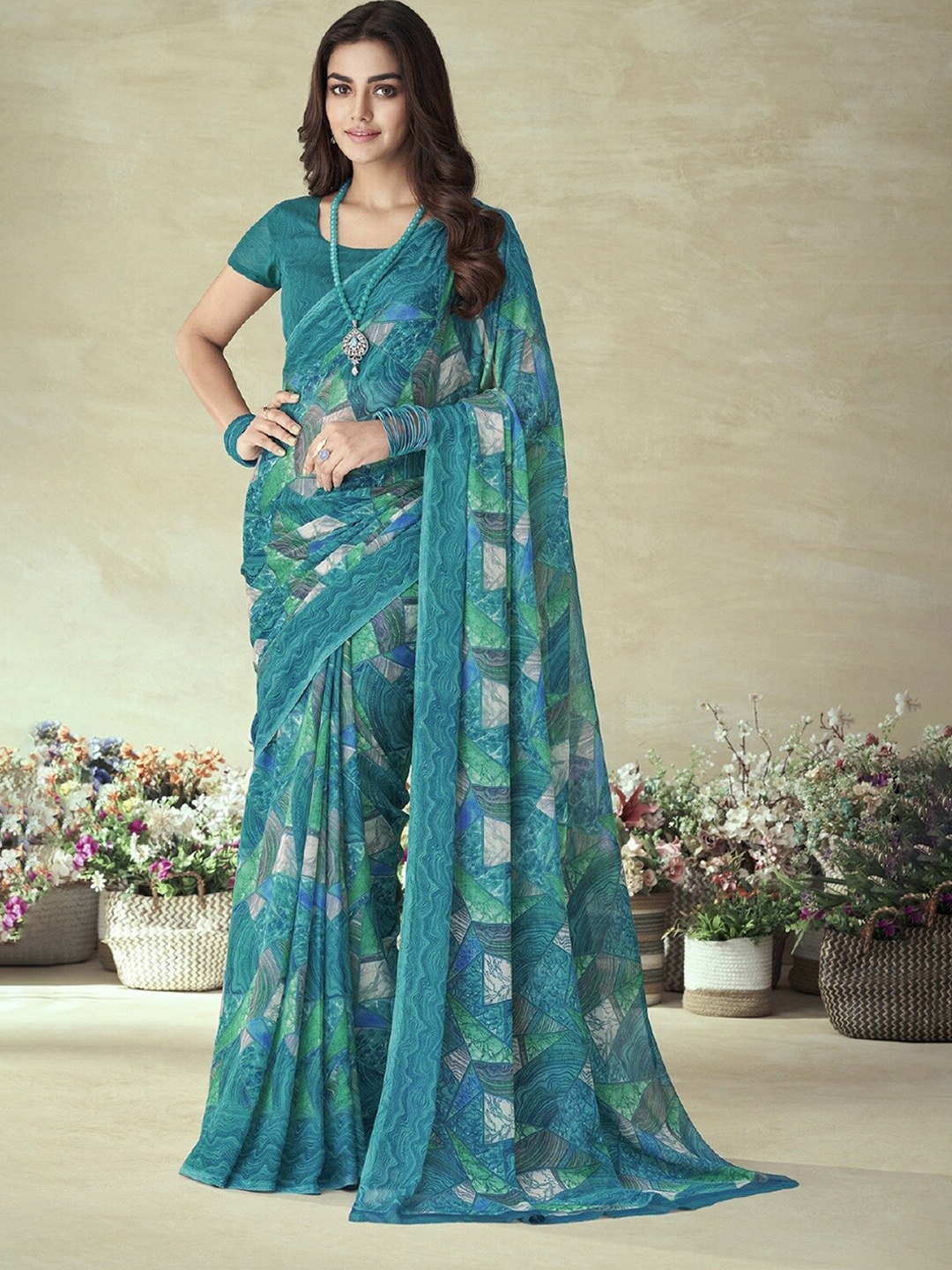 

Reboot Fashions Pure Chiffon Saree, Teal