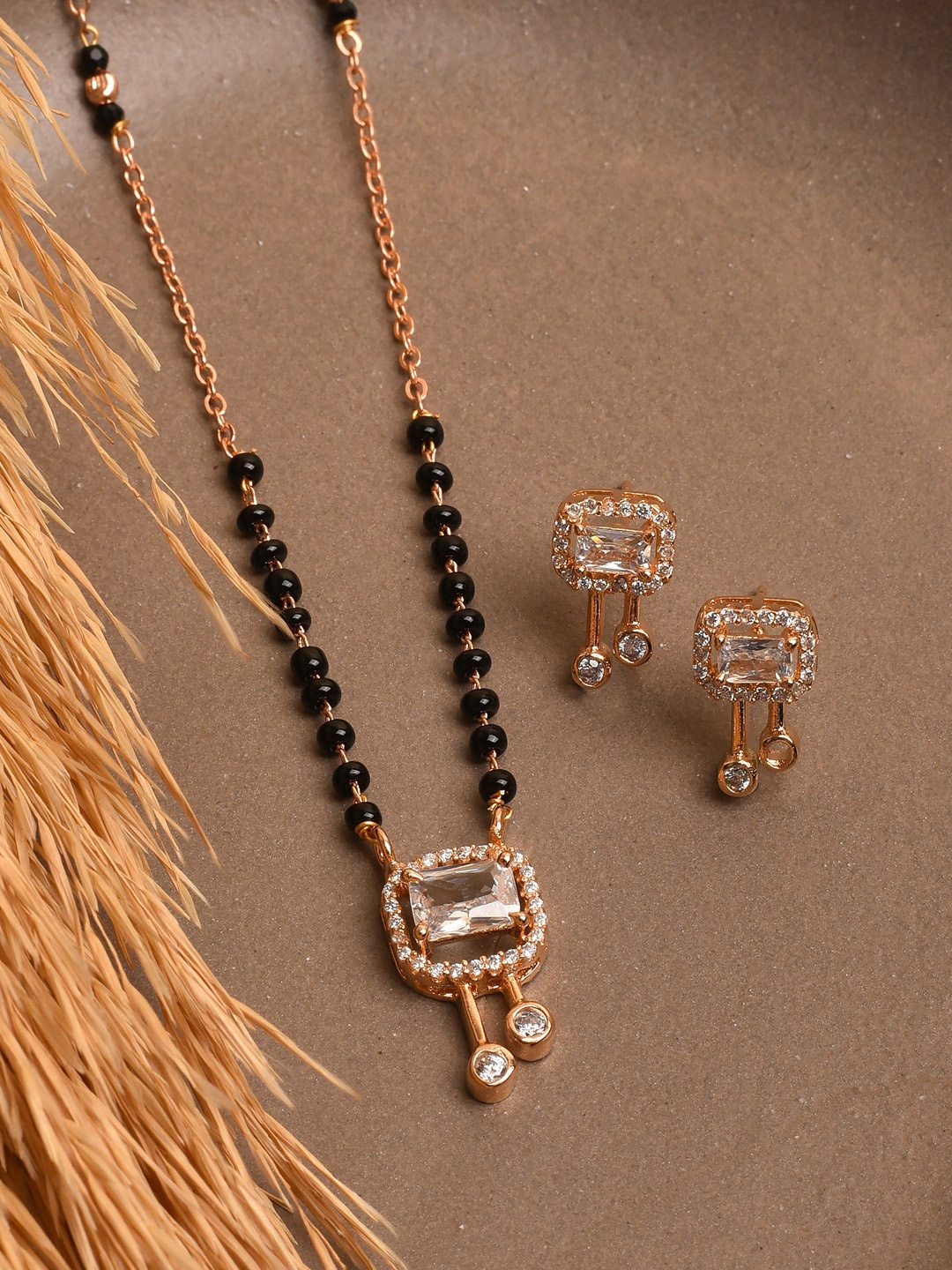 

XPNSV Gold-Plated AD Stone Studded & Beaded Mangalsutra With Earrings