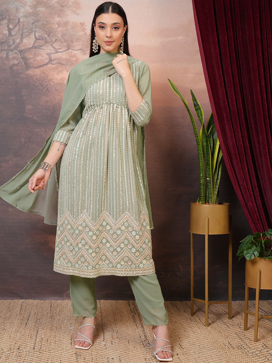 

Vishudh Beige Embroidered Mirror Work Empire A-Line Kurta With Trousers & Dupatta