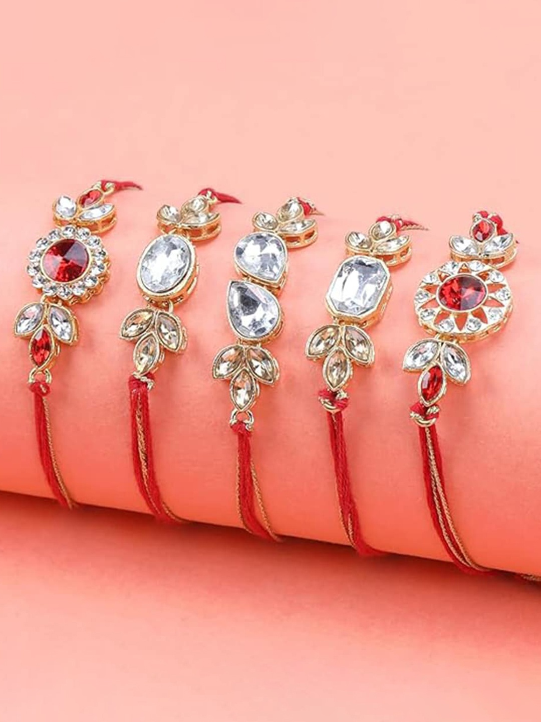 

Kaameri Bazaar Set Of 5 Stone Studded Rakhis with Roli Chawal & Greeting Card, Gold