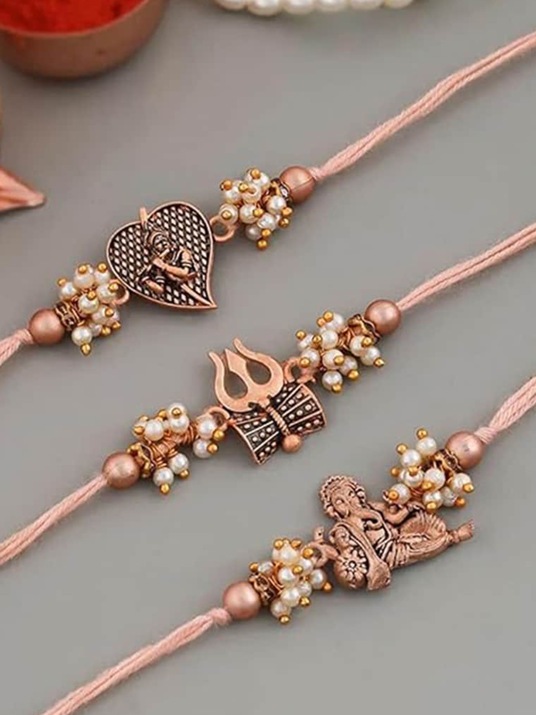 

Kaameri Bazaar Set Of 3 Rakhis with Roli Chawal & Greeting Card, Copper