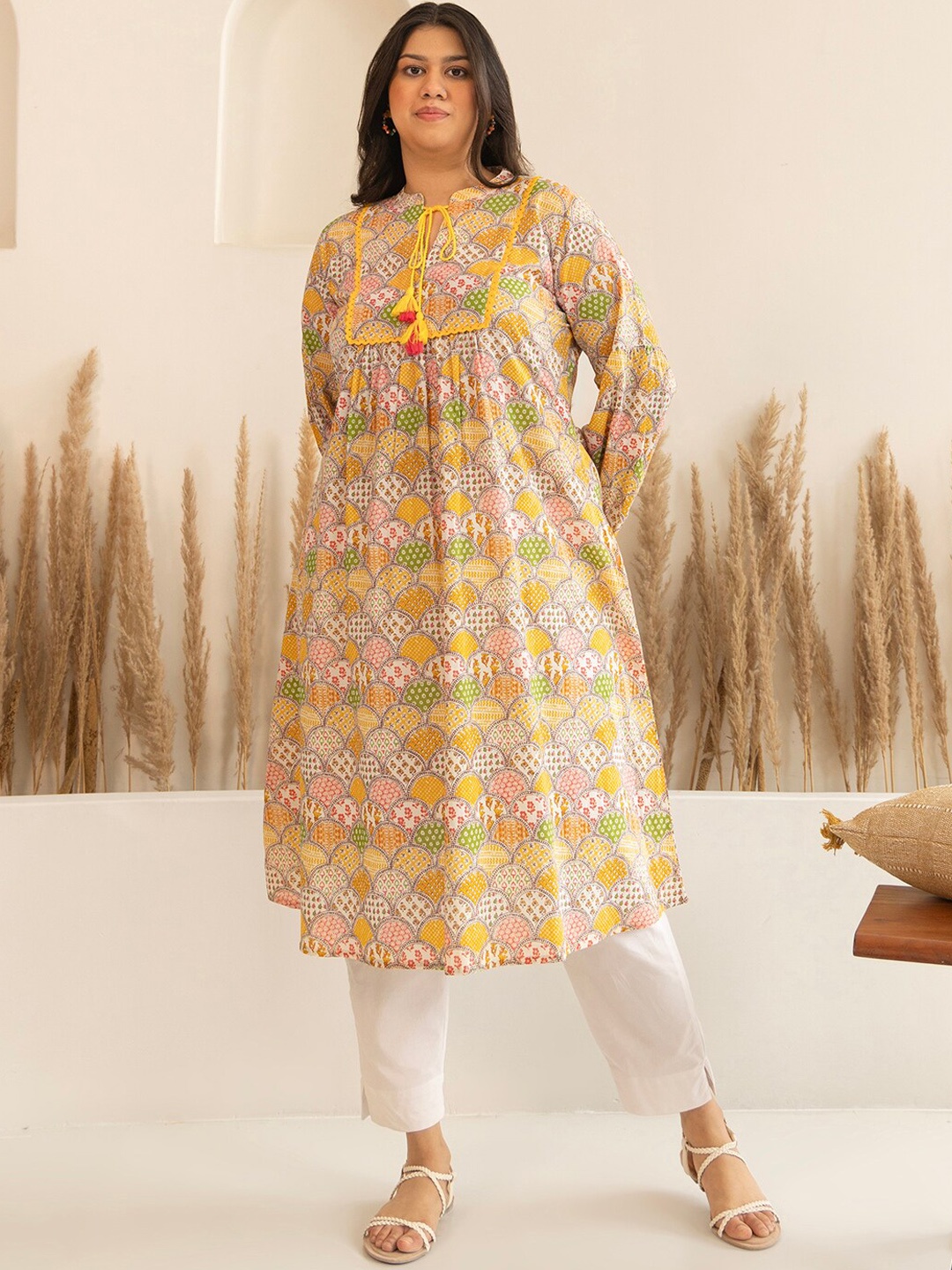

Janasya Plus Size Ethnic Motifs Printed Tie-Up Neck Puff Sleeves A-Line Kurta, Yellow
