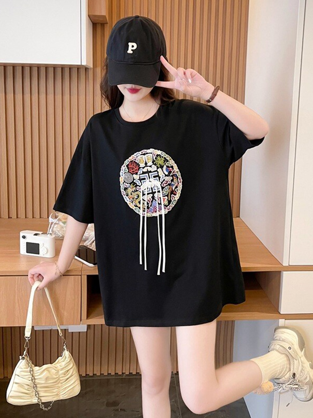 

StyleCast x Revolte Black Graphic Printed Cotton Top