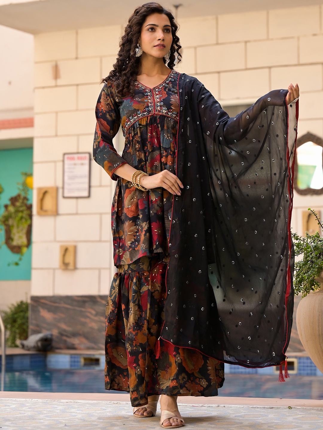 

Peachmode V Neck Floral Printed Pleated Sequinned Chanderi Silk Top with Sharara & Dupatta, Black