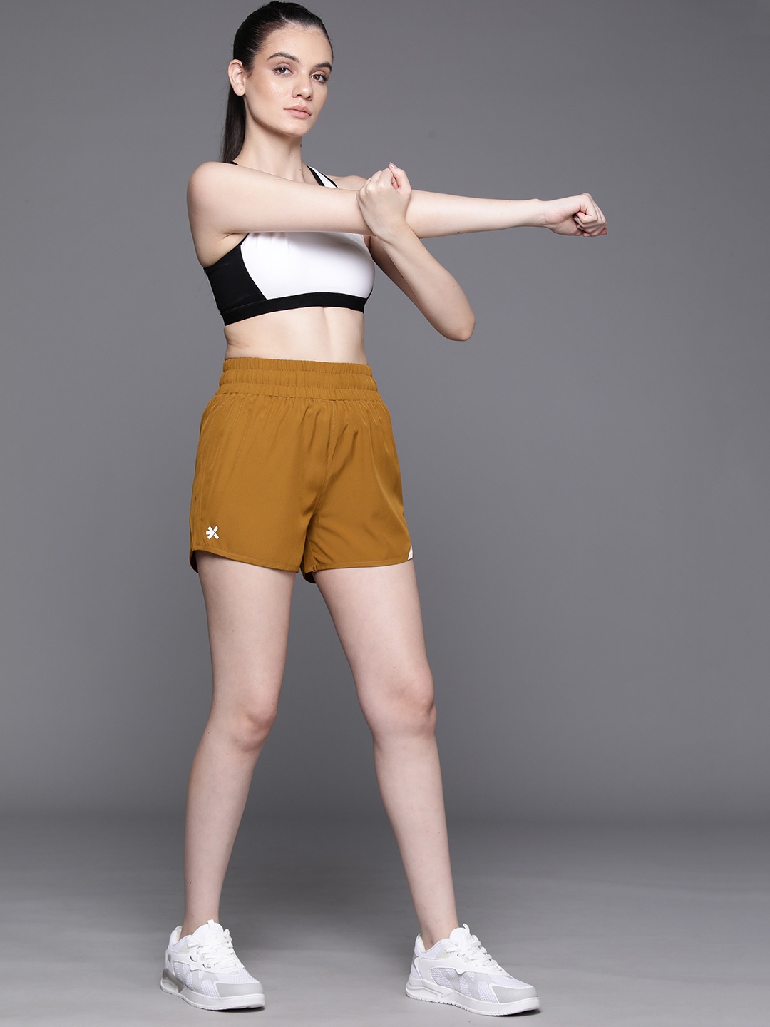 

HRX by Hrithik Roshan Women Solid Sports Shorts, Mustard