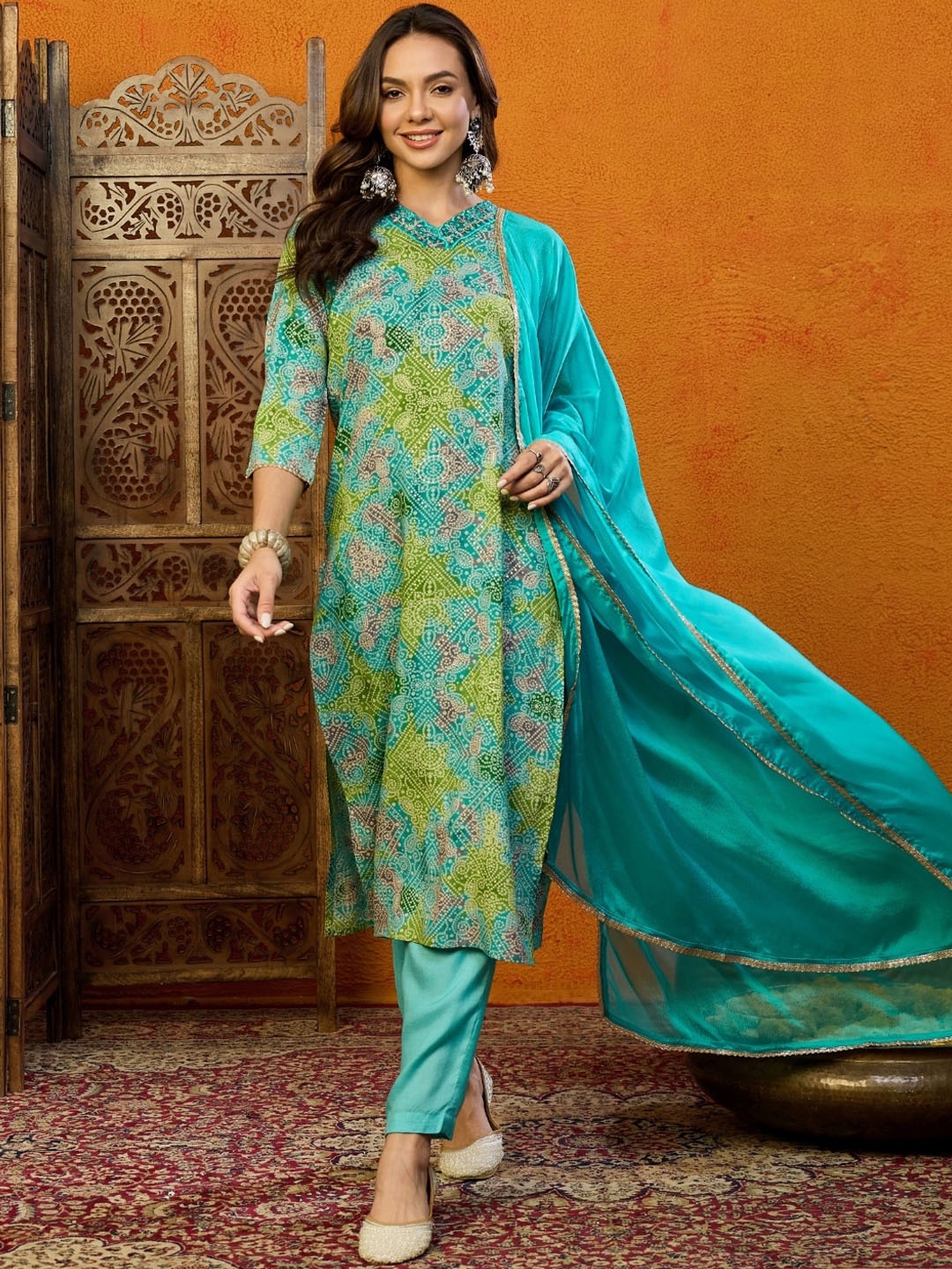 

AHIKA Bandhani Printed Regular Thread Work Straight Kurta With Trousers & Dupatta, Blue
