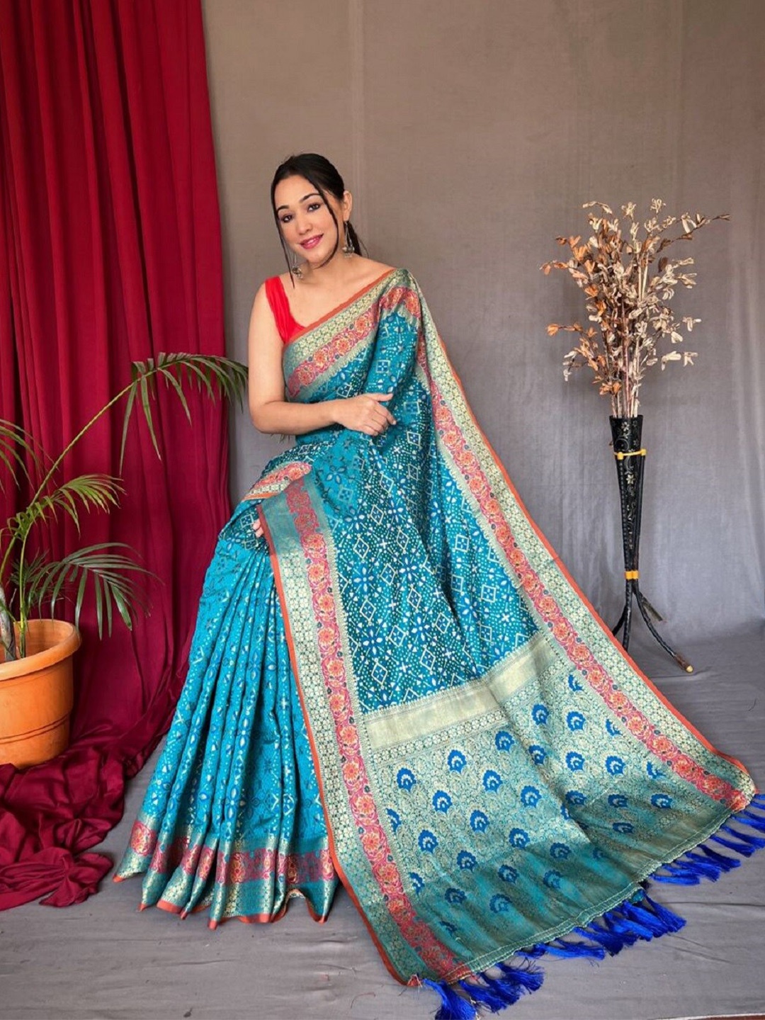 

Nimidiya Ethnic Motifs Woven Design Zari Patola Saree, Blue