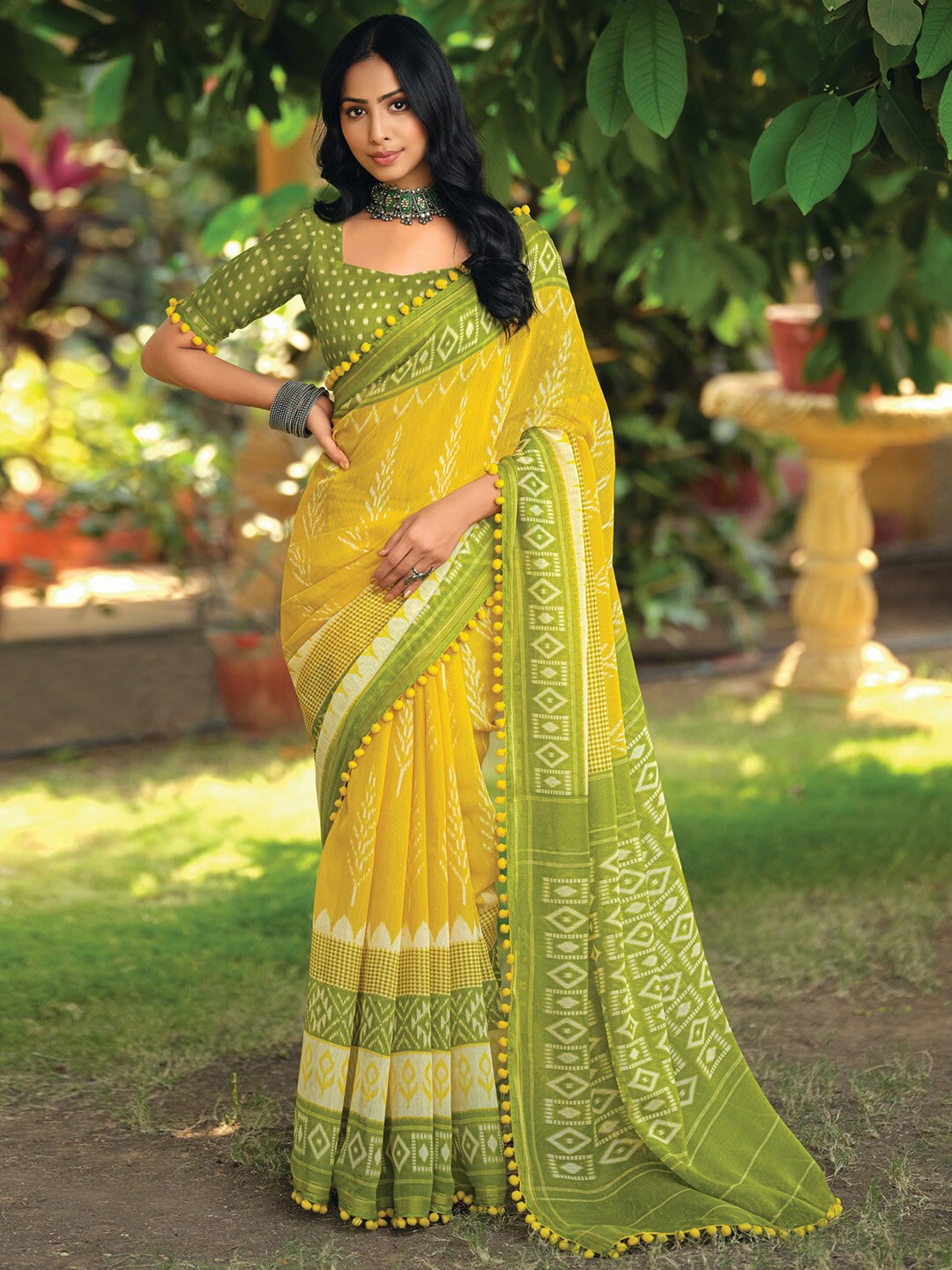 

Anouk Rustic Yellow Ethnic Motifs Printed Ikat Saree