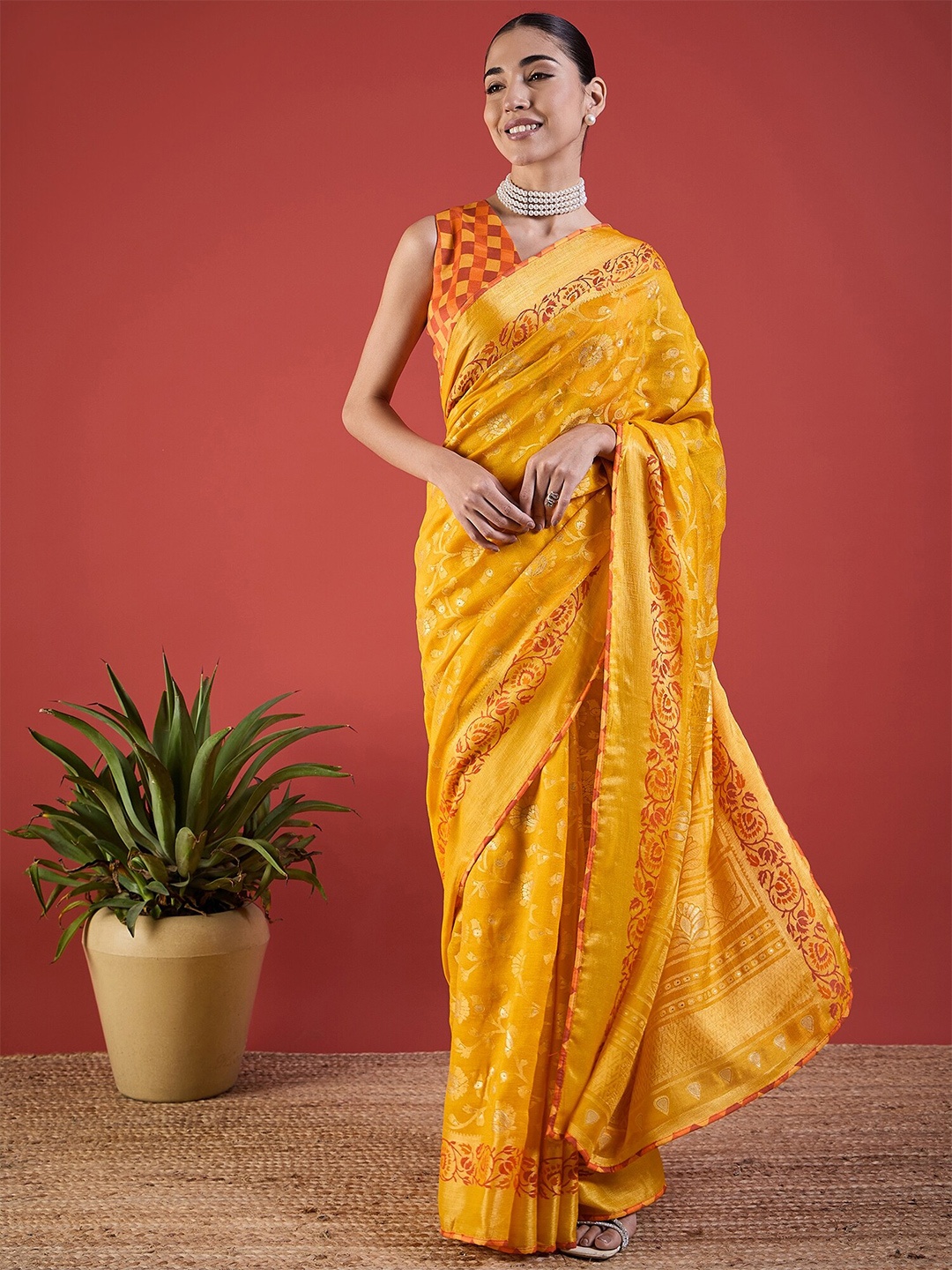 

Anouk Yellow Ethnic Motifs Woven Design Zari Brasso Saree