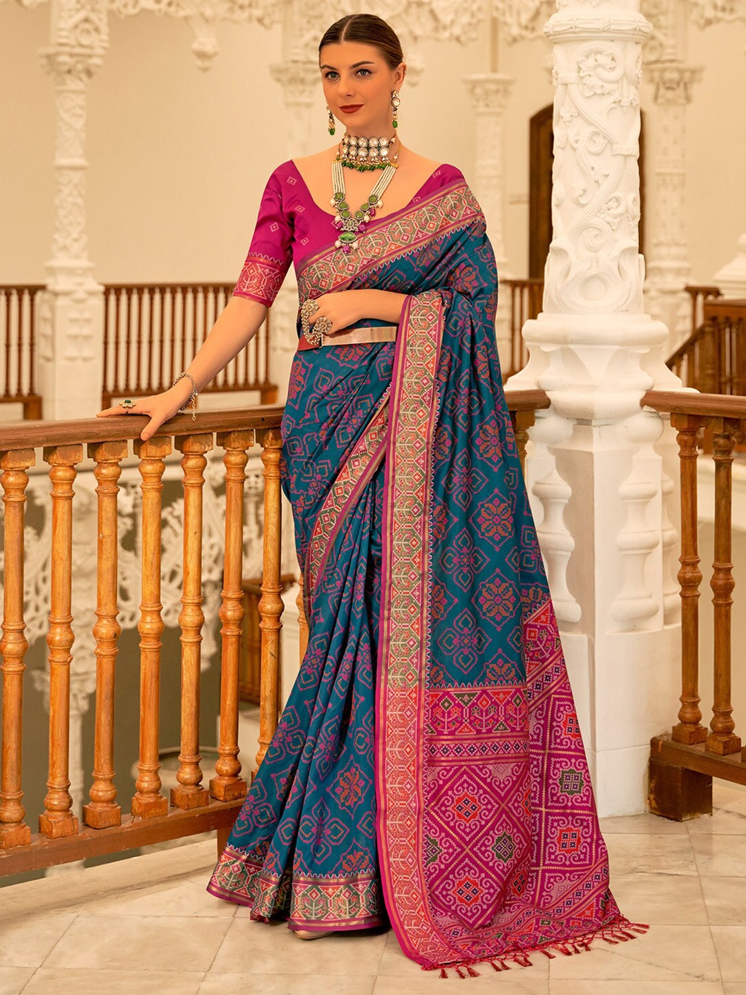 

Anouk Teal Blue Ethnic Motifs Printed Zari Ikat Saree