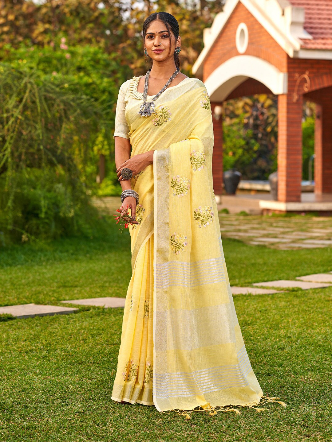 

Ishin Yellow Floral Embroidered Zari Saree