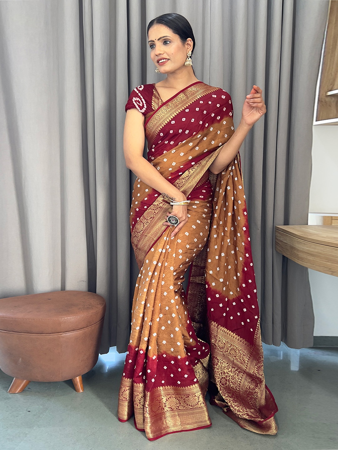 

Anouk Rust and white Woven Design Zari Bandhani Saree