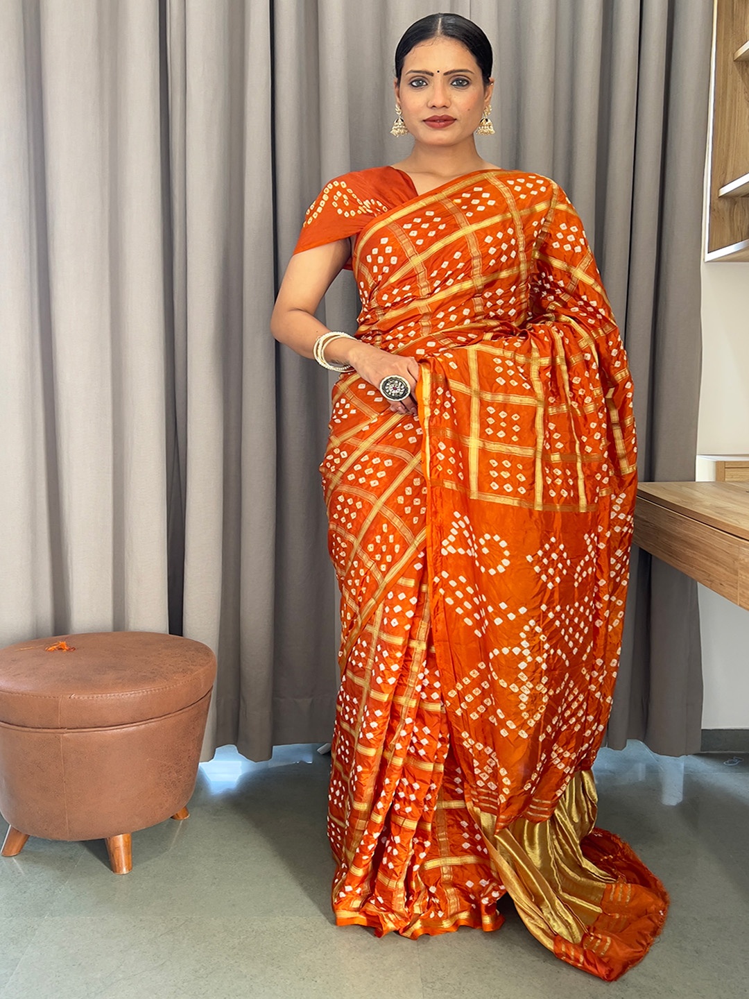 

Anouk Rust Woven Design Zari Bandhani Saree