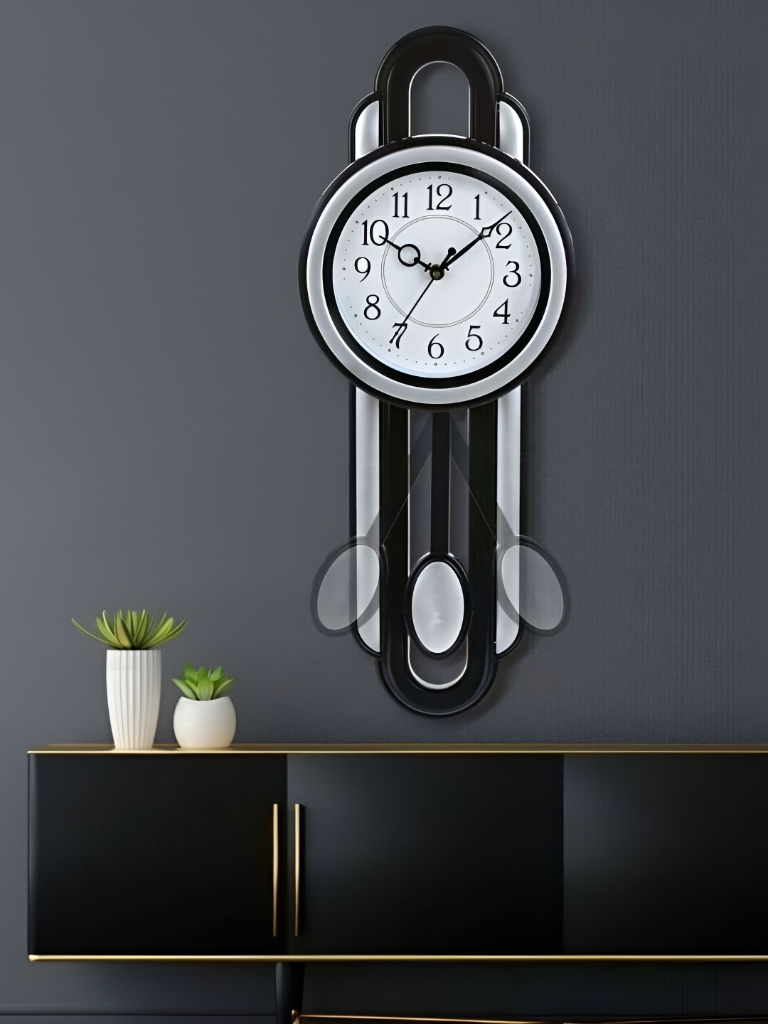 

Attractionz Silver-Toned & White Textured Contemporary Round Shaped Pendulum Wall Clock