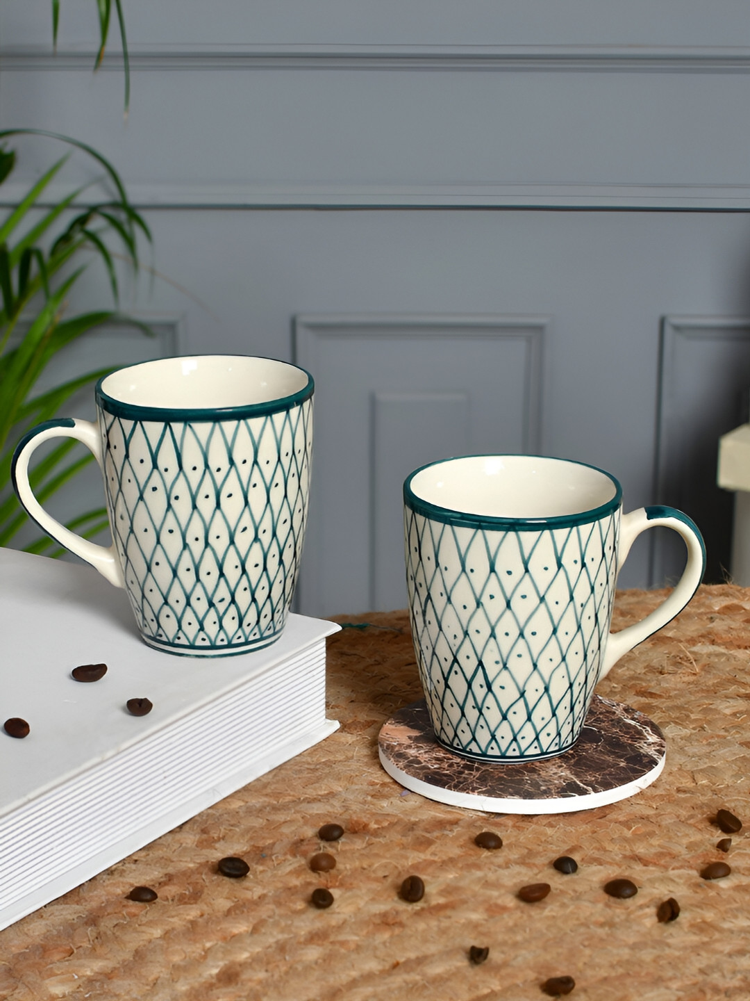

Aura Teal & Cream-Coloured 2 Pieces Geometric Printed Ceramic Glossy Mugs 250 ml