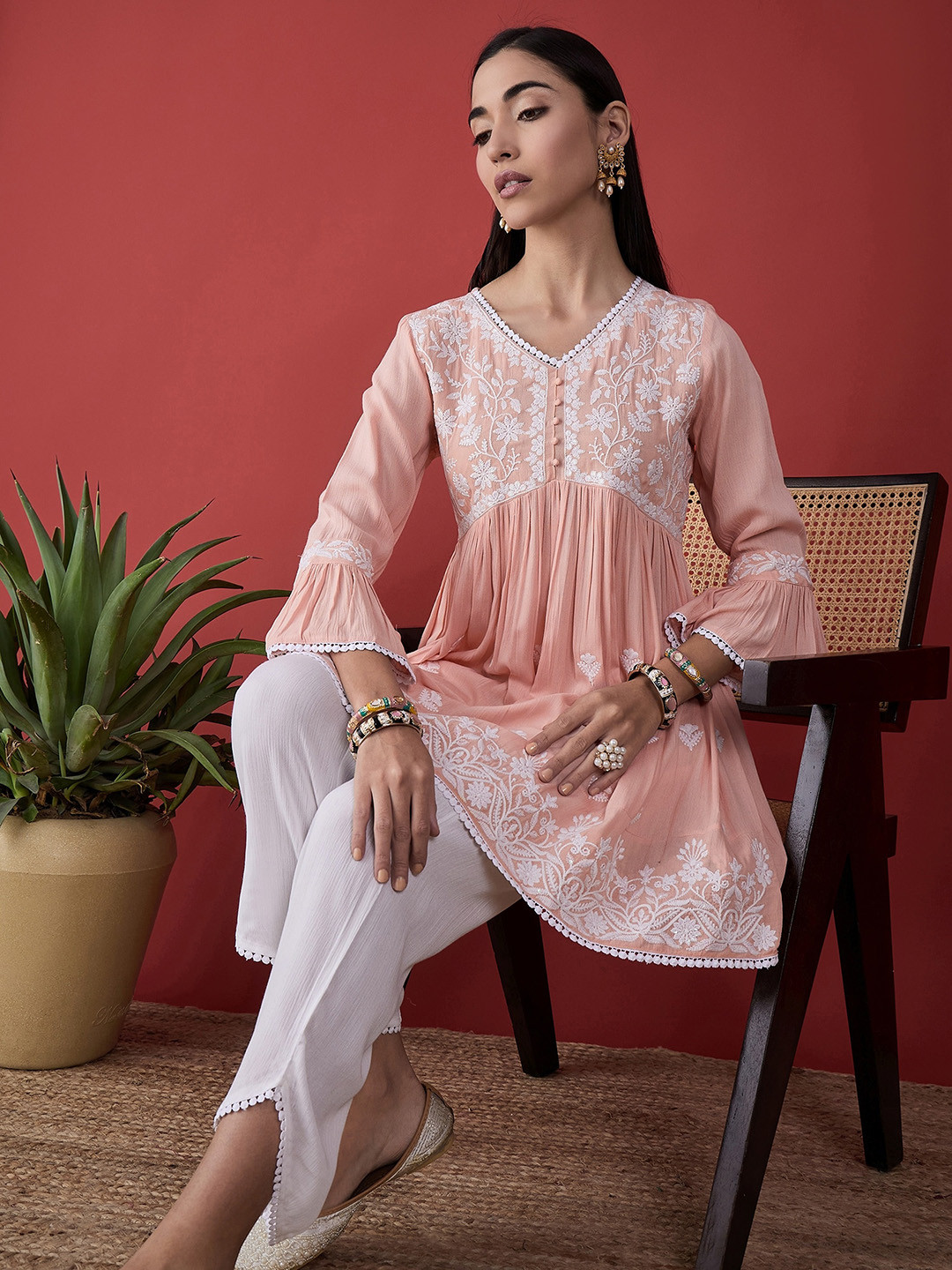 

Anouk Floral Embroidered Bell Sleeves Empire Thread Work A-Line Kurti with Trousers, Peach