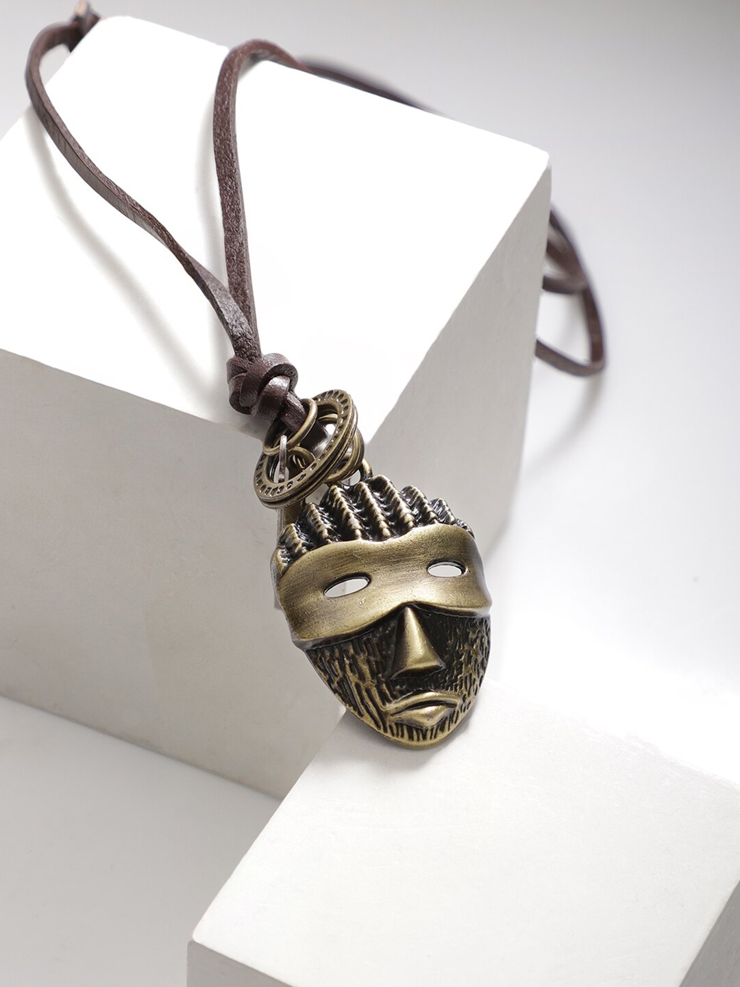

Rubans Voguish Brown Leather Cord Necklace with Bronze Mask Pendant