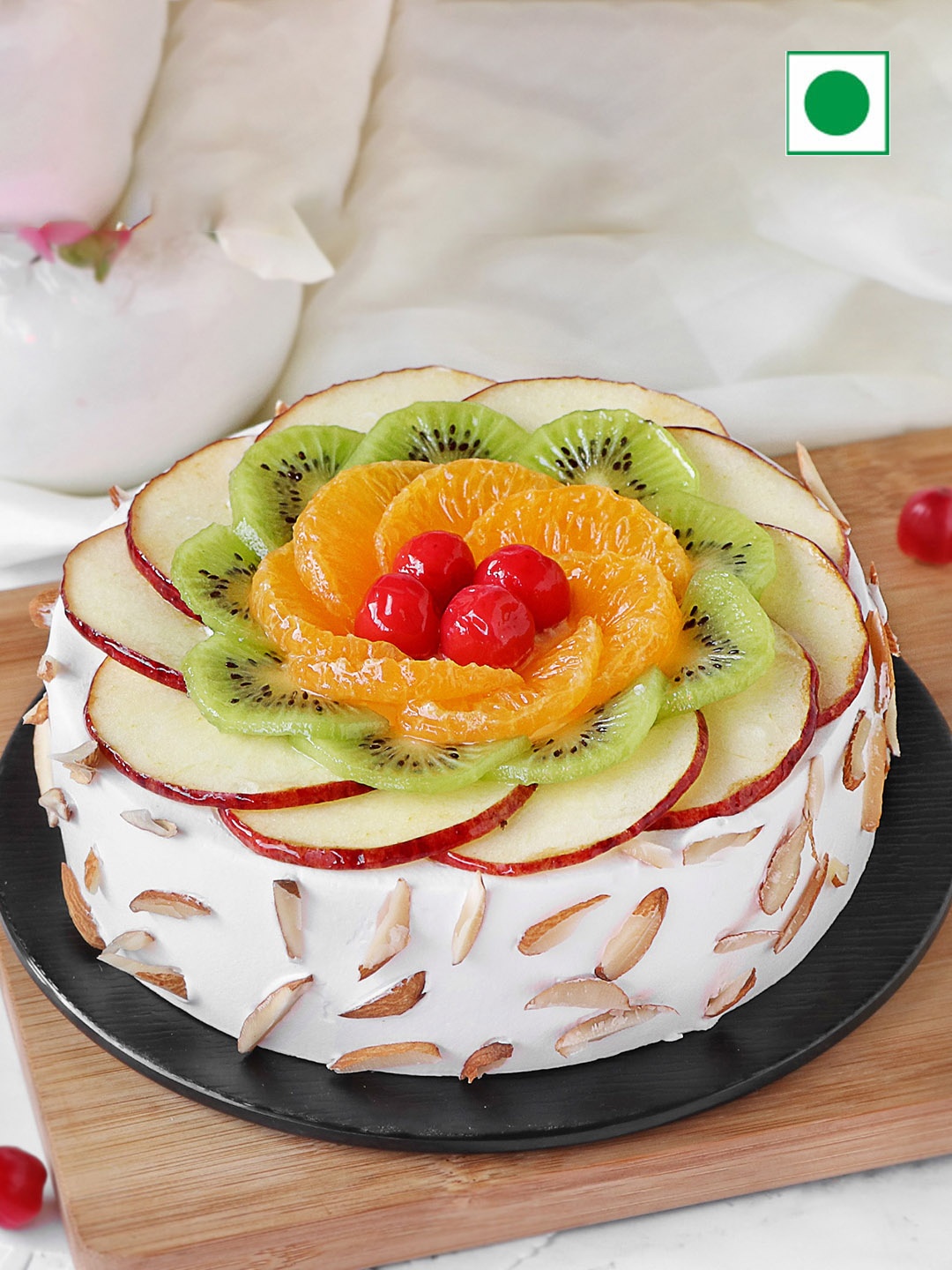 

IGP Fresh Fruit Almond Flavour Eggless Round Cake- 500gms, White