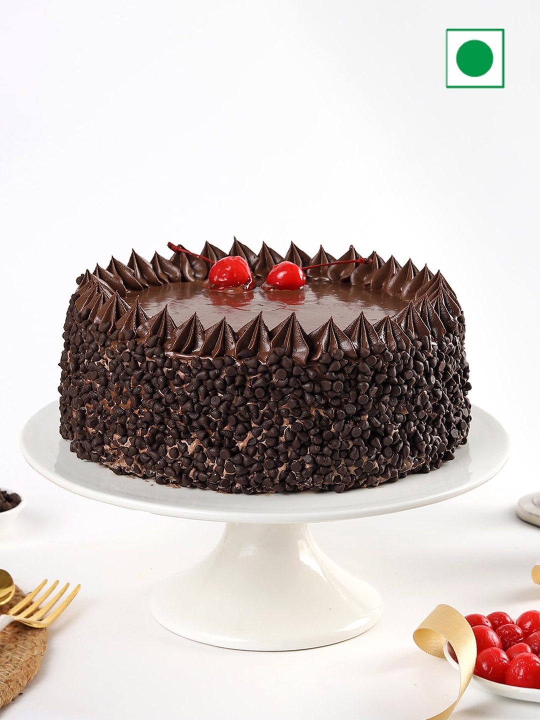 

IGP Chocolate Flavour Chips & Cherry Toppings Eggless Round Cake- 500 gms, Brown