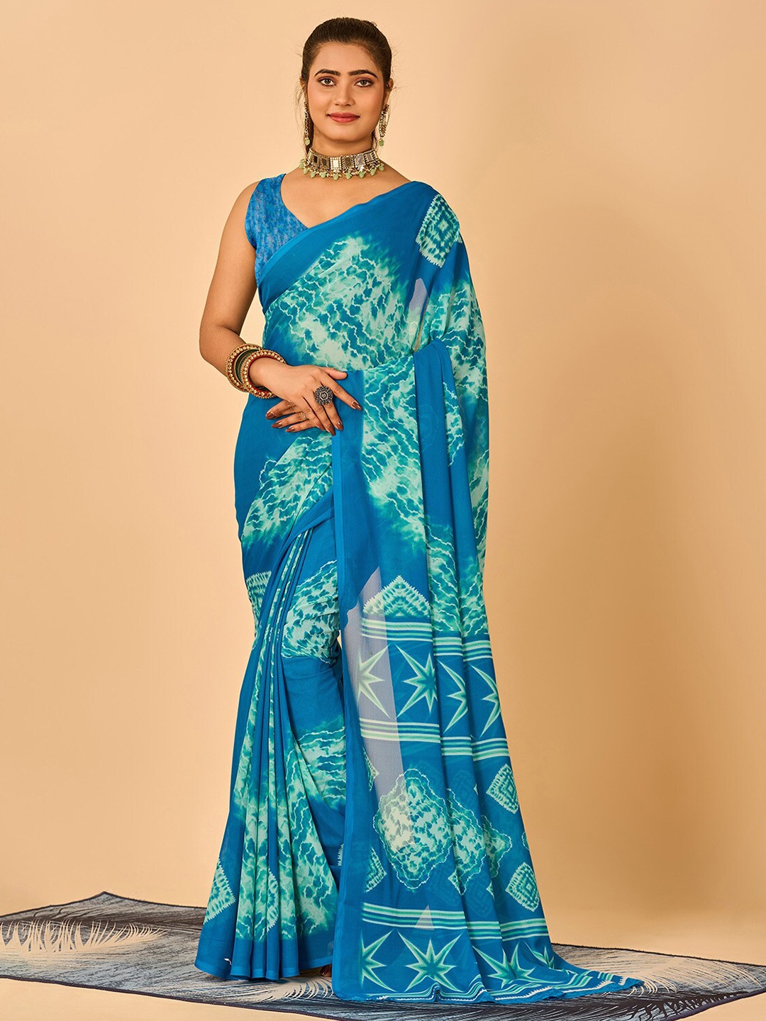 

NIRMAL CREATION Shibori Printed Pure Georgette Saree, Turquoise blue