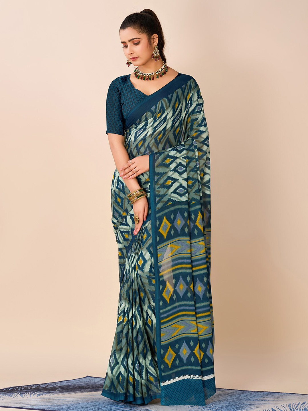 

NIRMAL CREATION Geometric Printed Pure Georgette Saree, Turquoise blue