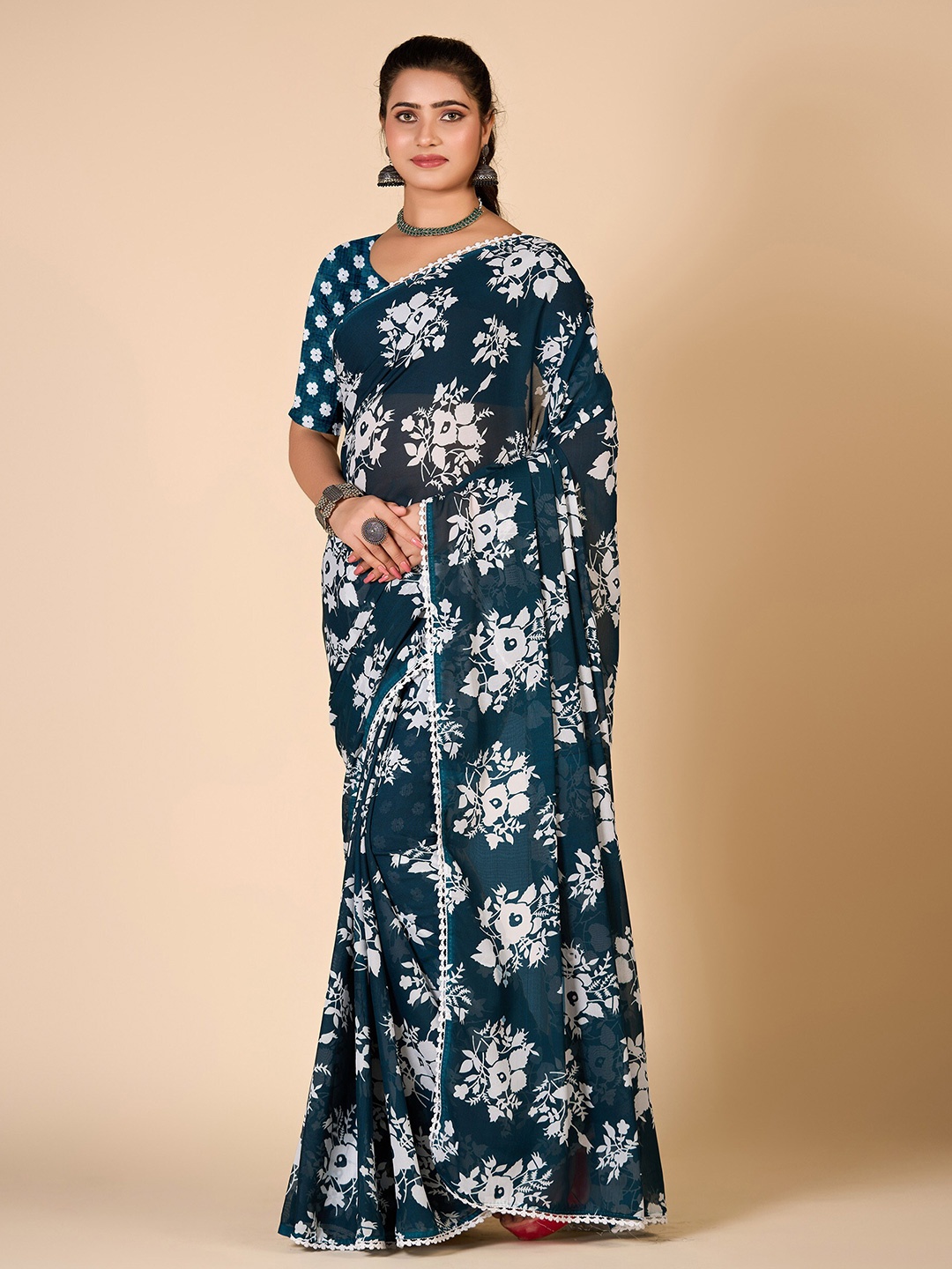 

NIRMAL CREATION Floral Embroidered Pure Georgette Saree, Turquoise blue