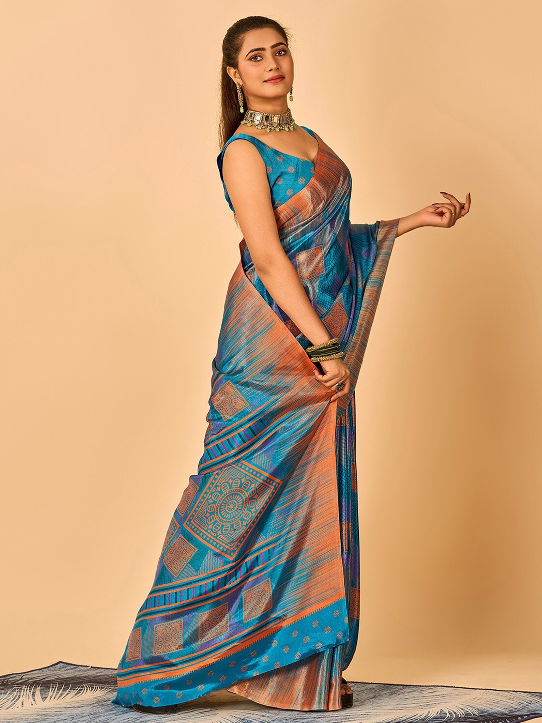 

NIRMAL CREATION Geometric Printed Pure Crepe Saree, Turquoise blue