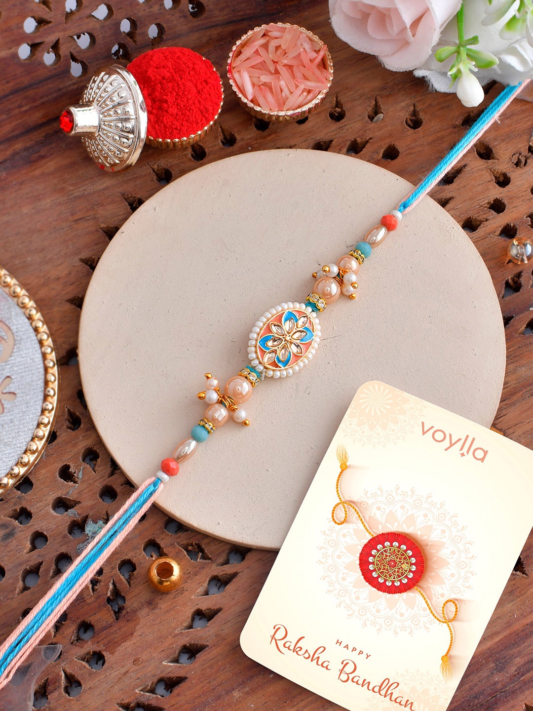 

Voylla Men Thread Traditional Design Pearls Rakhi, Blue