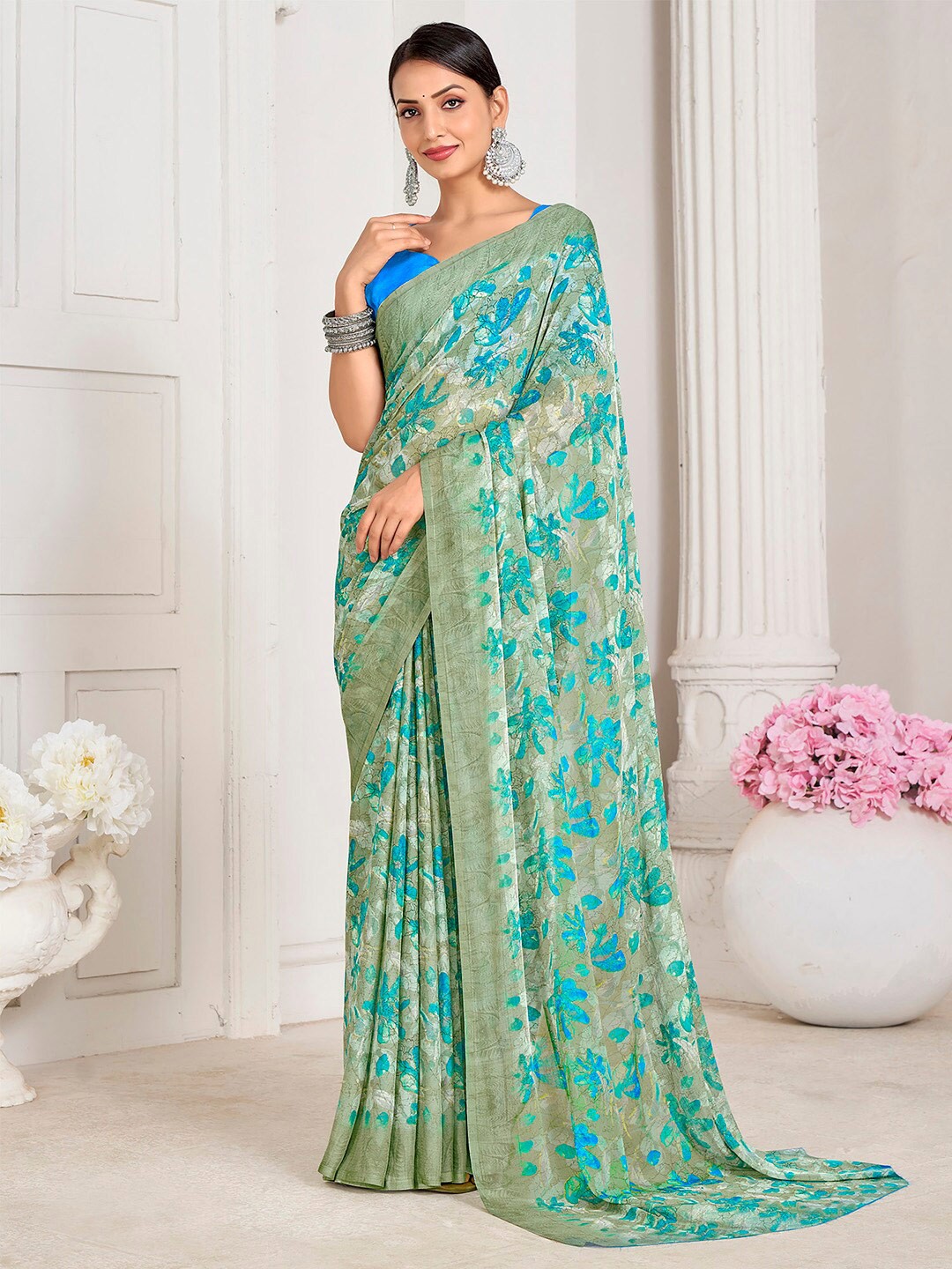 

Mitera Sea Green Floral Printed Poly Chiffon Bagru Saree