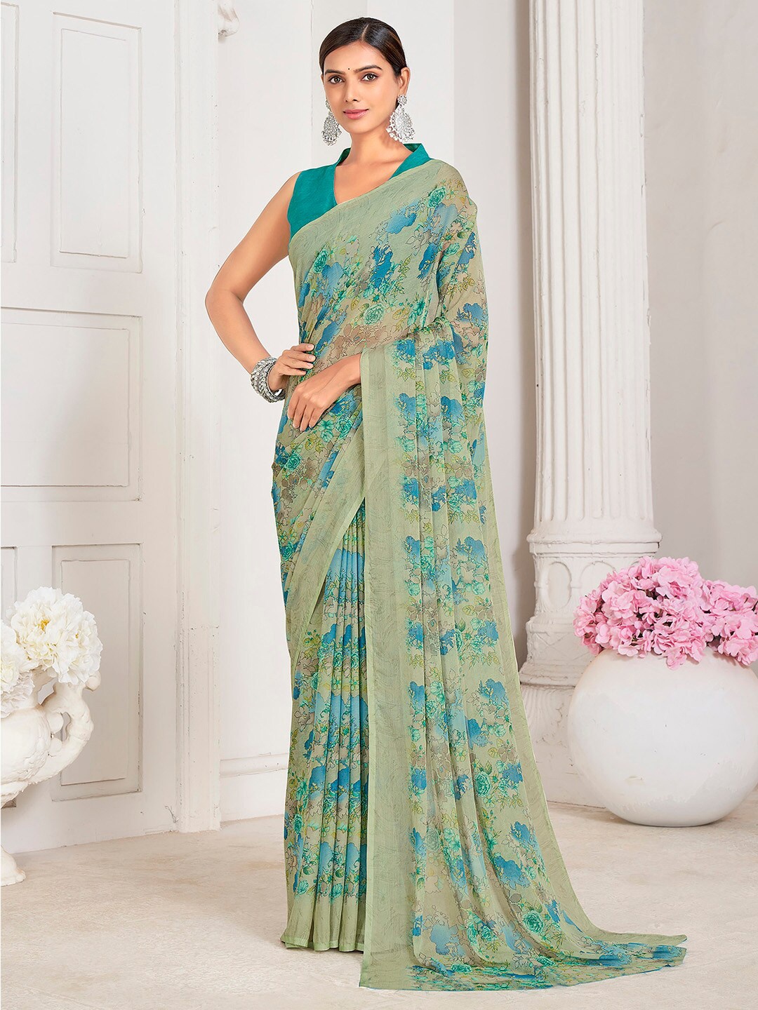 

Mitera Sea Green Floral Printed Poly Chiffon Bagru Saree
