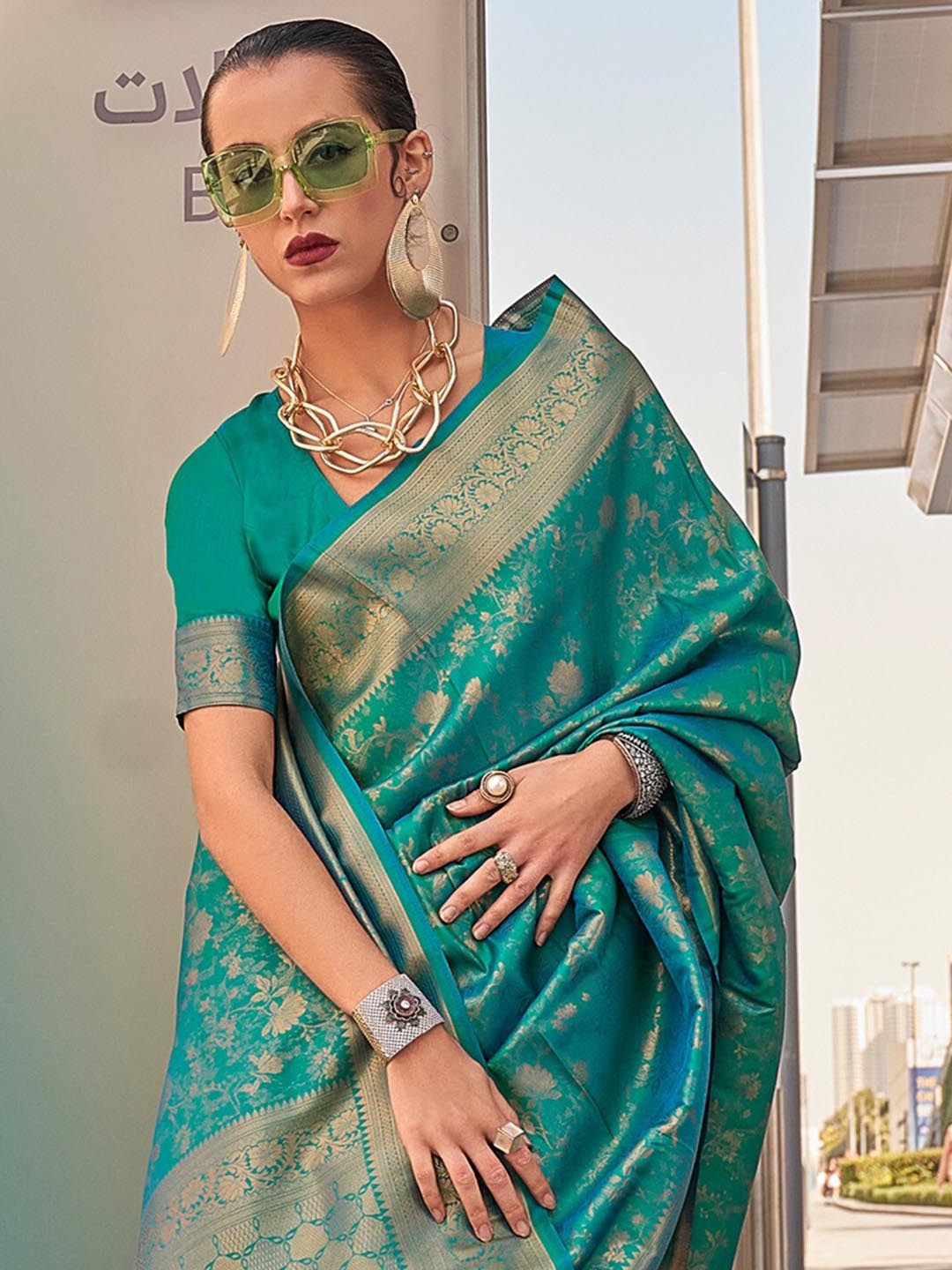 

Saree mall Teal Green & Gold Toned Ethnic Motifs Zari Kanjeevaram Sarees