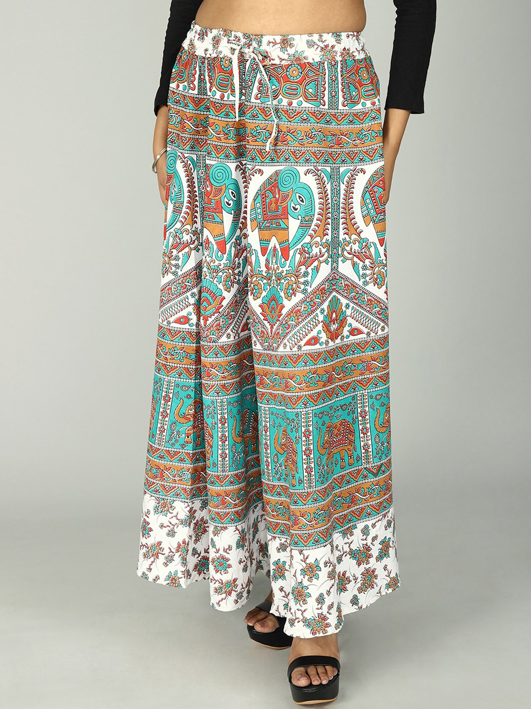 

Exotic India Pure Cotton Sanganeri Long Skirt with All Over Floral-Elephant Printed Motifs, Teal
