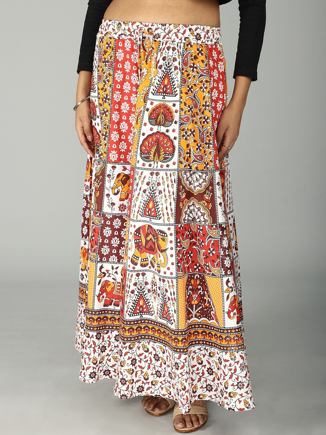 

Exotic India Pure Cotton Sanganeri Long Skirt with All Over Floral-Elephant Printed Motifs, Orange