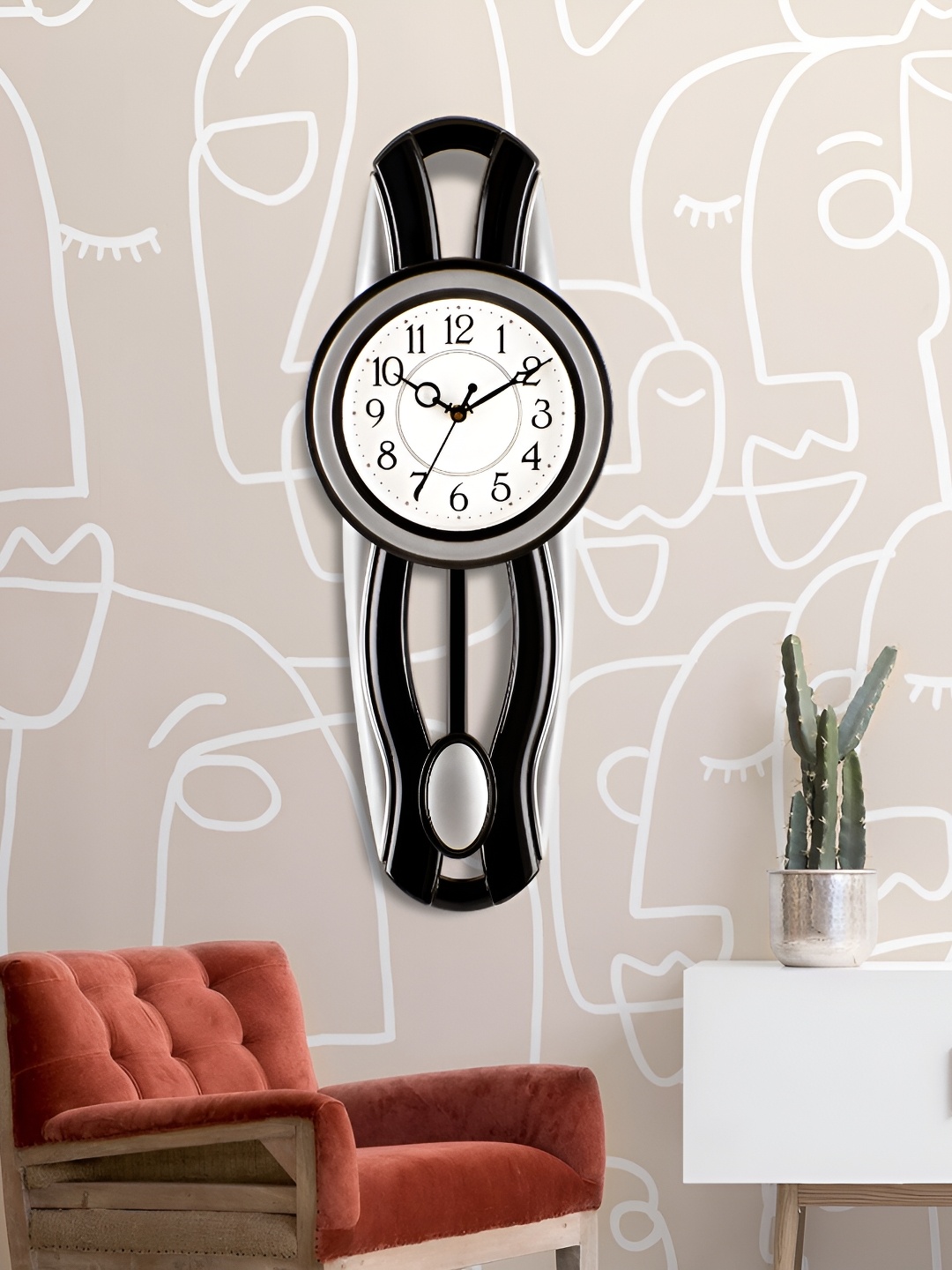 

Attractionz Silver-Toned & Black Round Shaped Contemporary Pendulum Analogue Wall Clock