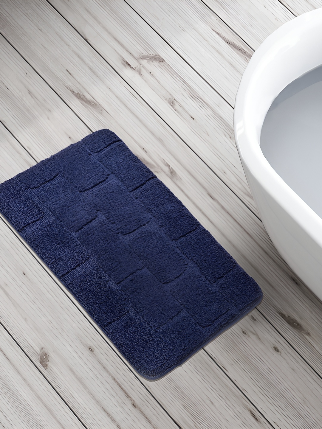 

Home Centre Blue Textured 240 GSM Anti-Skid Bath Rug