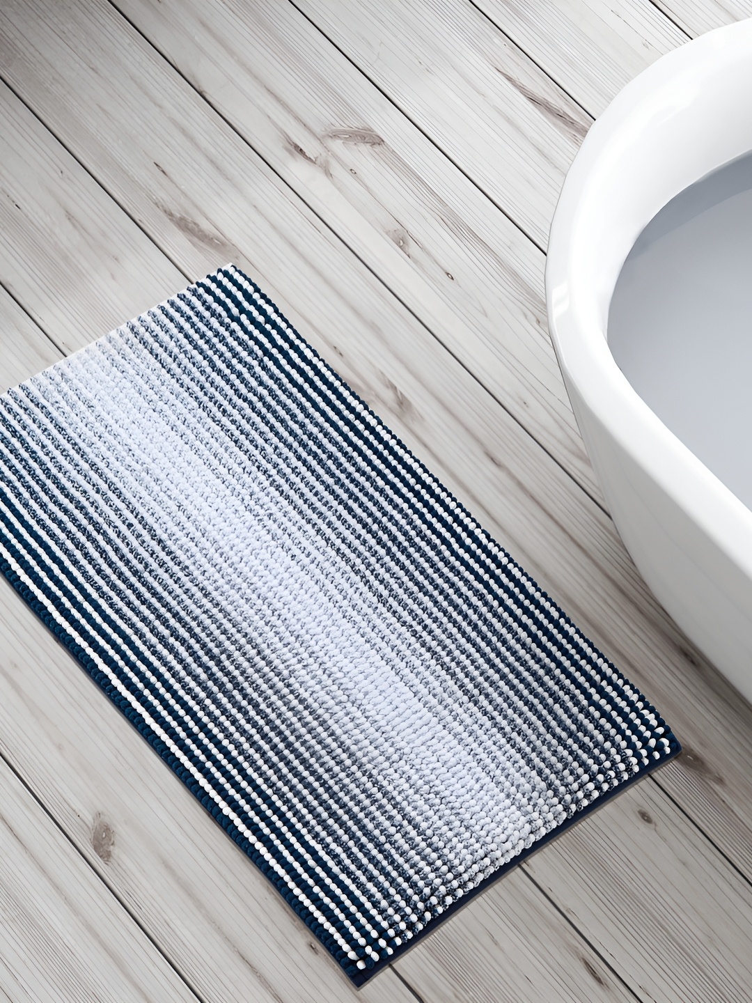 

Home Centre Blue & White Striped 240 GSM Anti-Skid Bath Rug