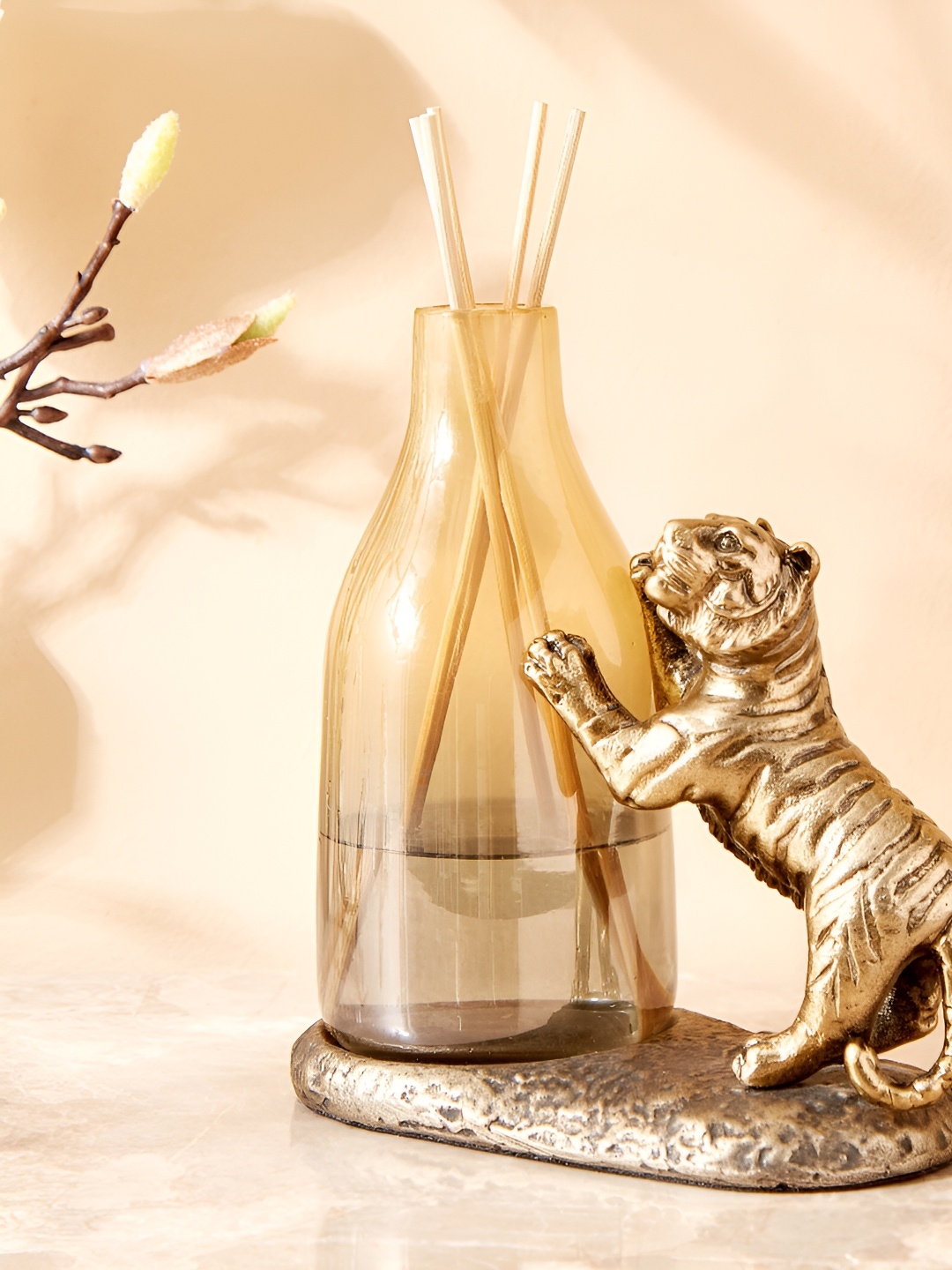 

Home Centre Gold-Toned Figurine Reed Diffuser Pot Showpiece