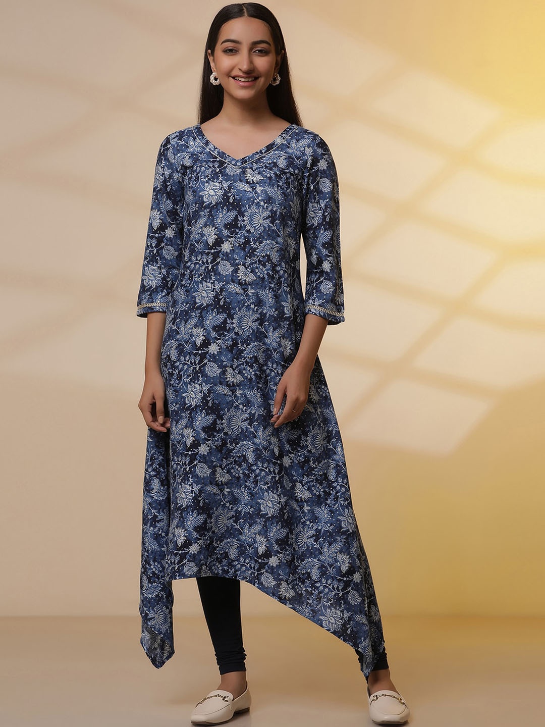 

AURELIA Floral Printed V-Neck Three-Quarter Sleeves Asymmetric A-Line Kurta With Leggings, Blue