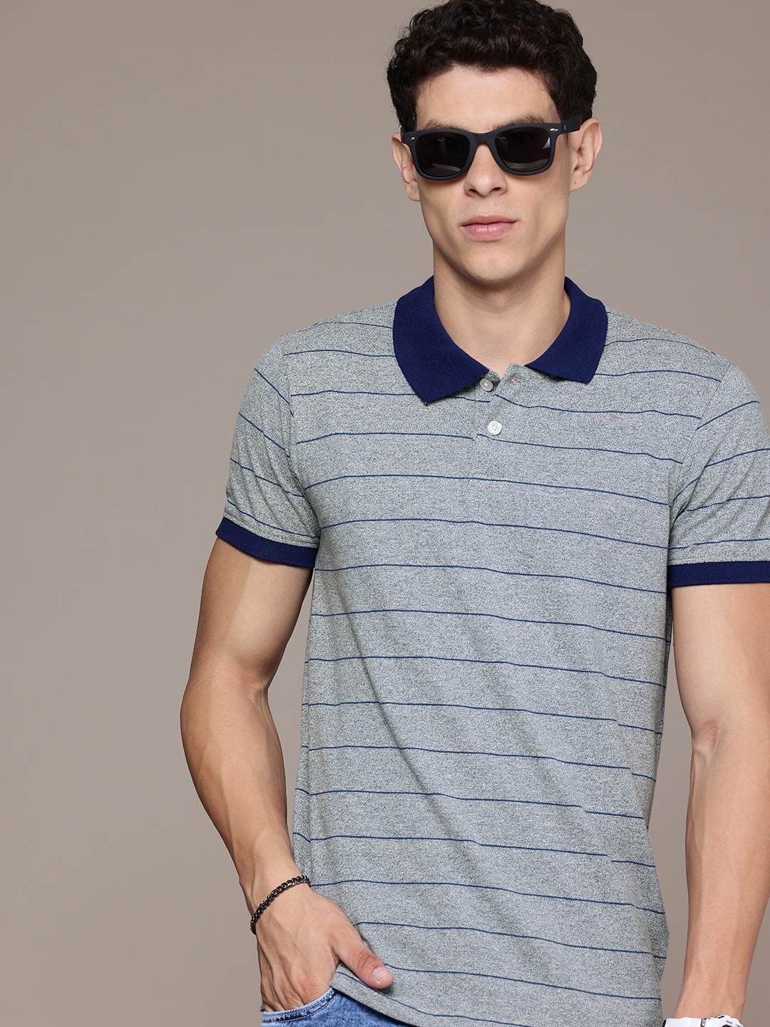 

Roadster Men Striped Polo Collar T-shirt, Blue