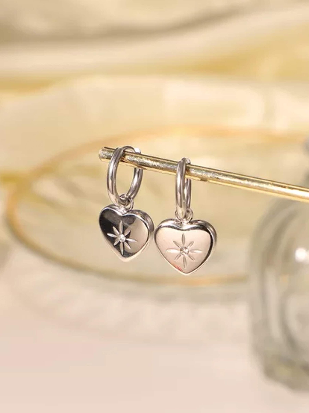 

Avyana Silver-Plated Heart Shaped Hoop Earrings
