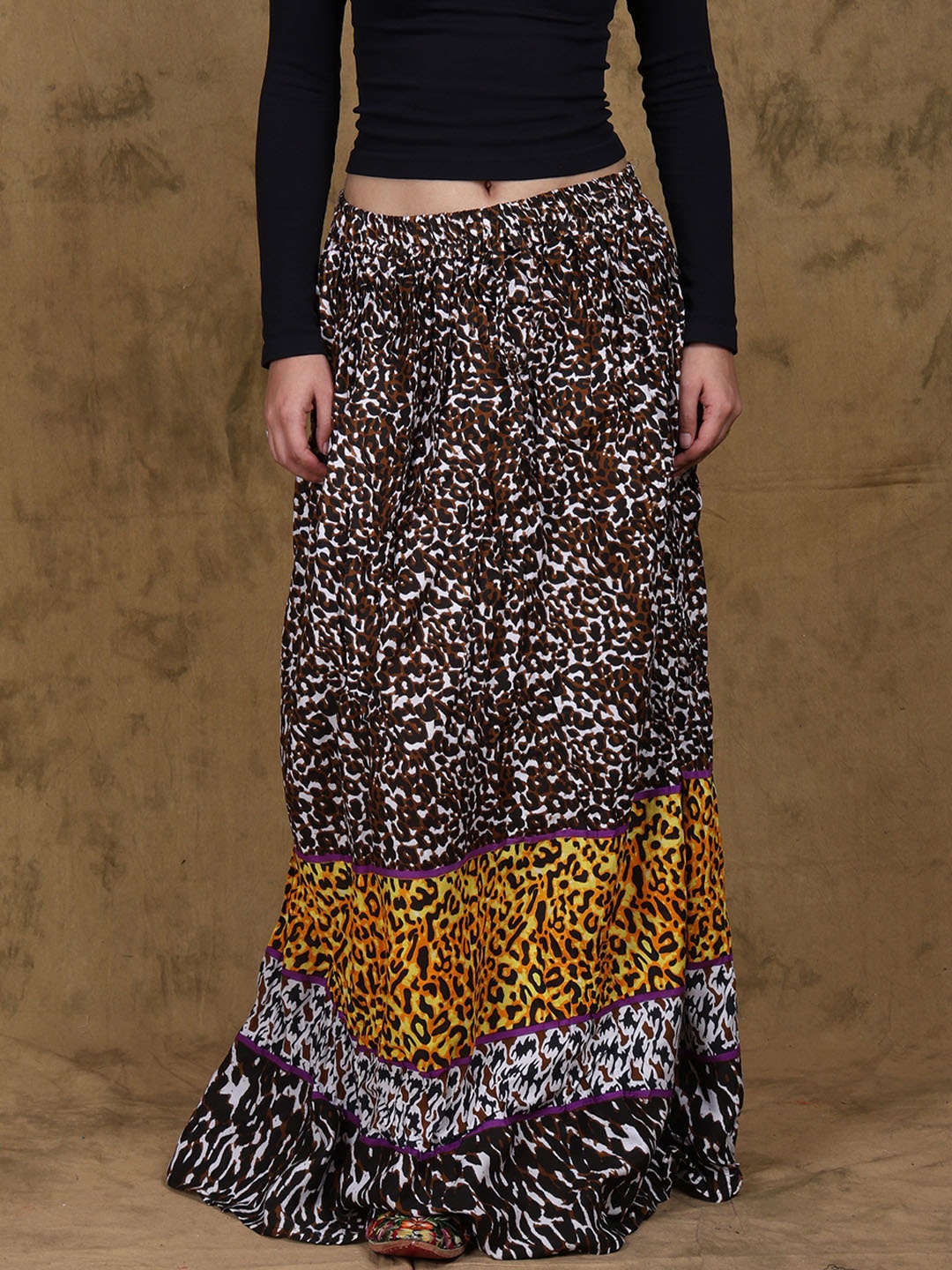 

Exotic India Leopard Sports Printed Tired Maxi Skirts, Brown