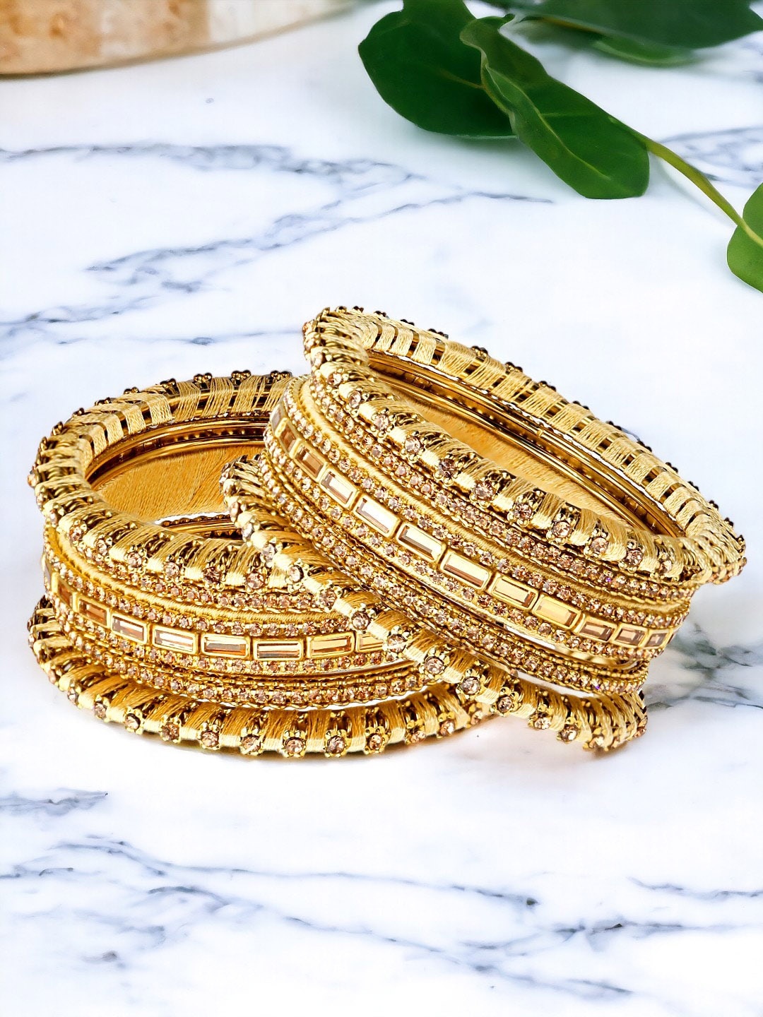 

FEMMIBELLA Set Of 10 Gold Plated Cubic Zirconia Studded Threadwork Bangles