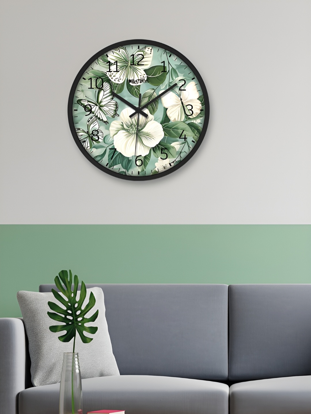 

OLIVE TREE Black & Green Printed Round Shaped Contemporary Analogue Wall Clock
