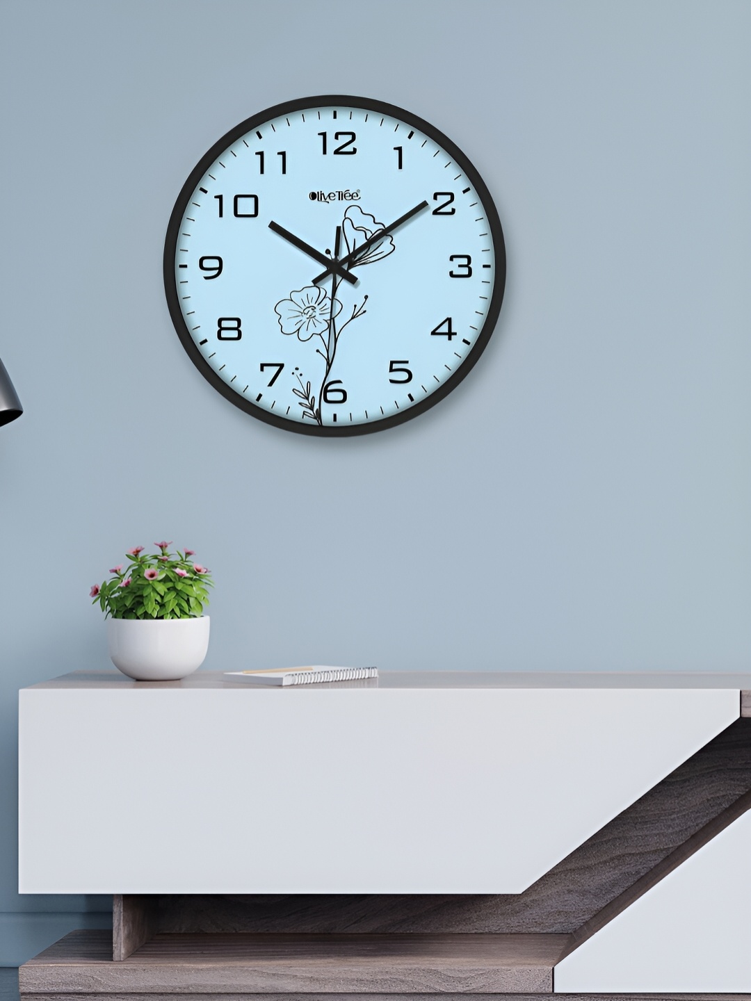 

OLIVE TREE Black & Blue Printed Round Shaped Contemporary Analogue Wall Clock
