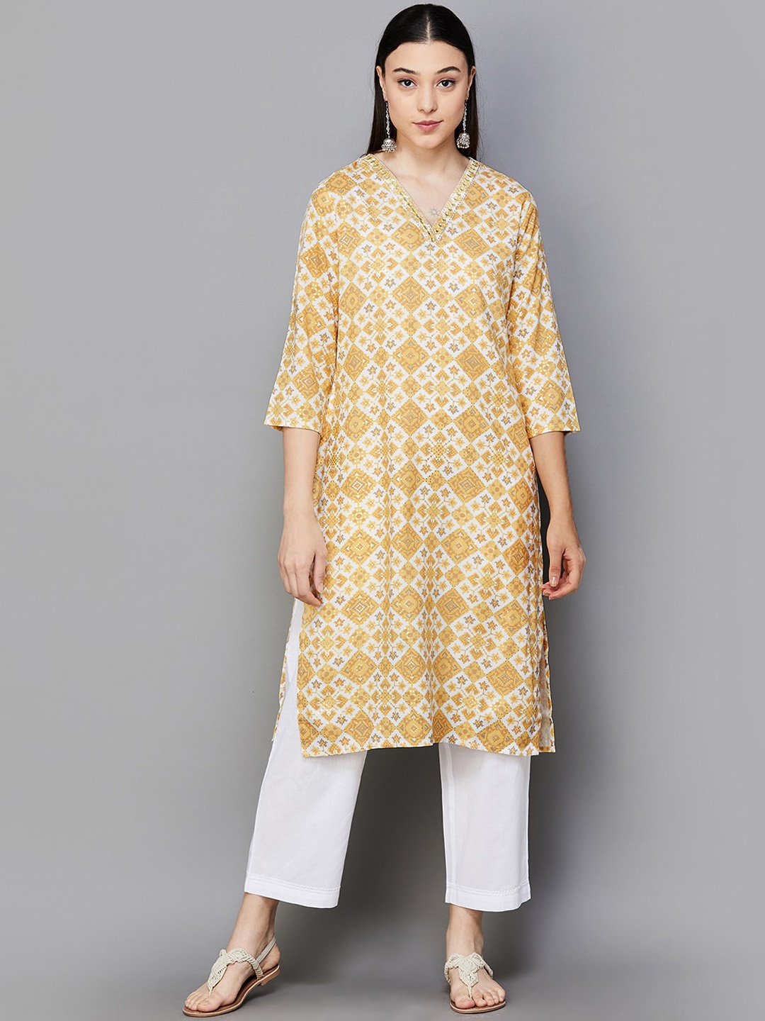 

Melange by Lifestyle Abstract Printed Curved V-Neck Sequinned A-Line Kurta, Mustard