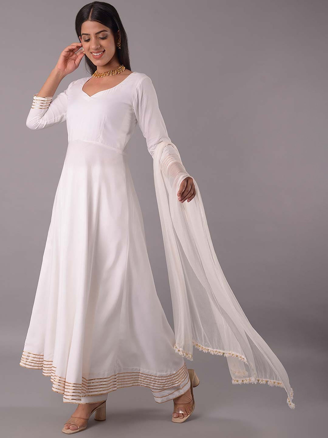 

Utsav Fashion V Neck Panelled Gotta Patti Anarkali Kurta with Trousers & With Dupatta, Off white